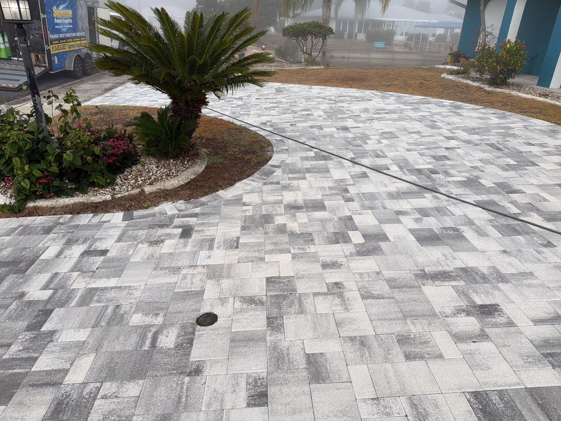 Modern Gray Paver Driveway and Entryway Walkway in Sun City Center by Supreme Paver Experts