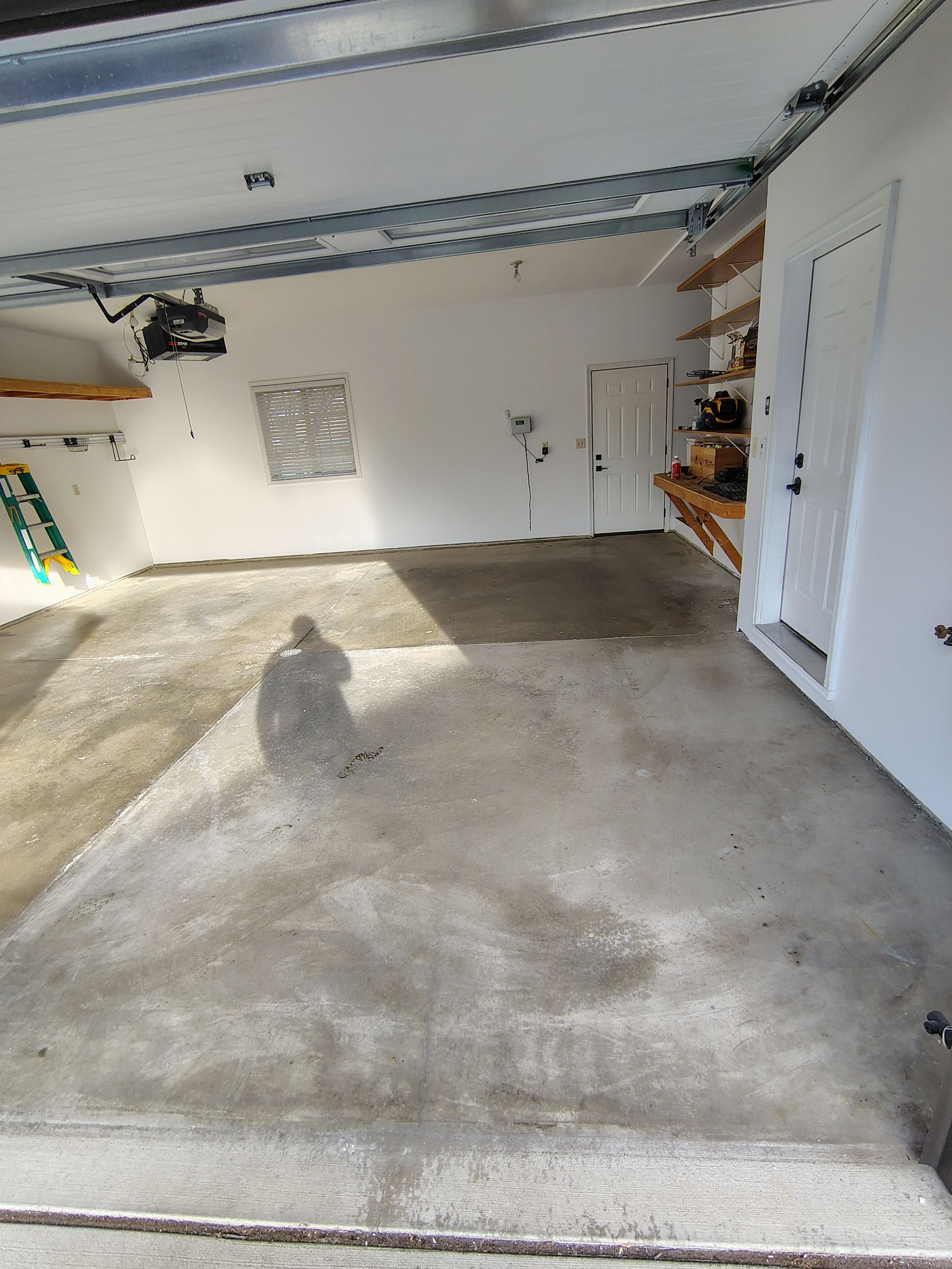 Grey Speckled Epoxy Garage Floor Coating in Sioux Falls by Select Painting, Coatings & Garage Cabinets