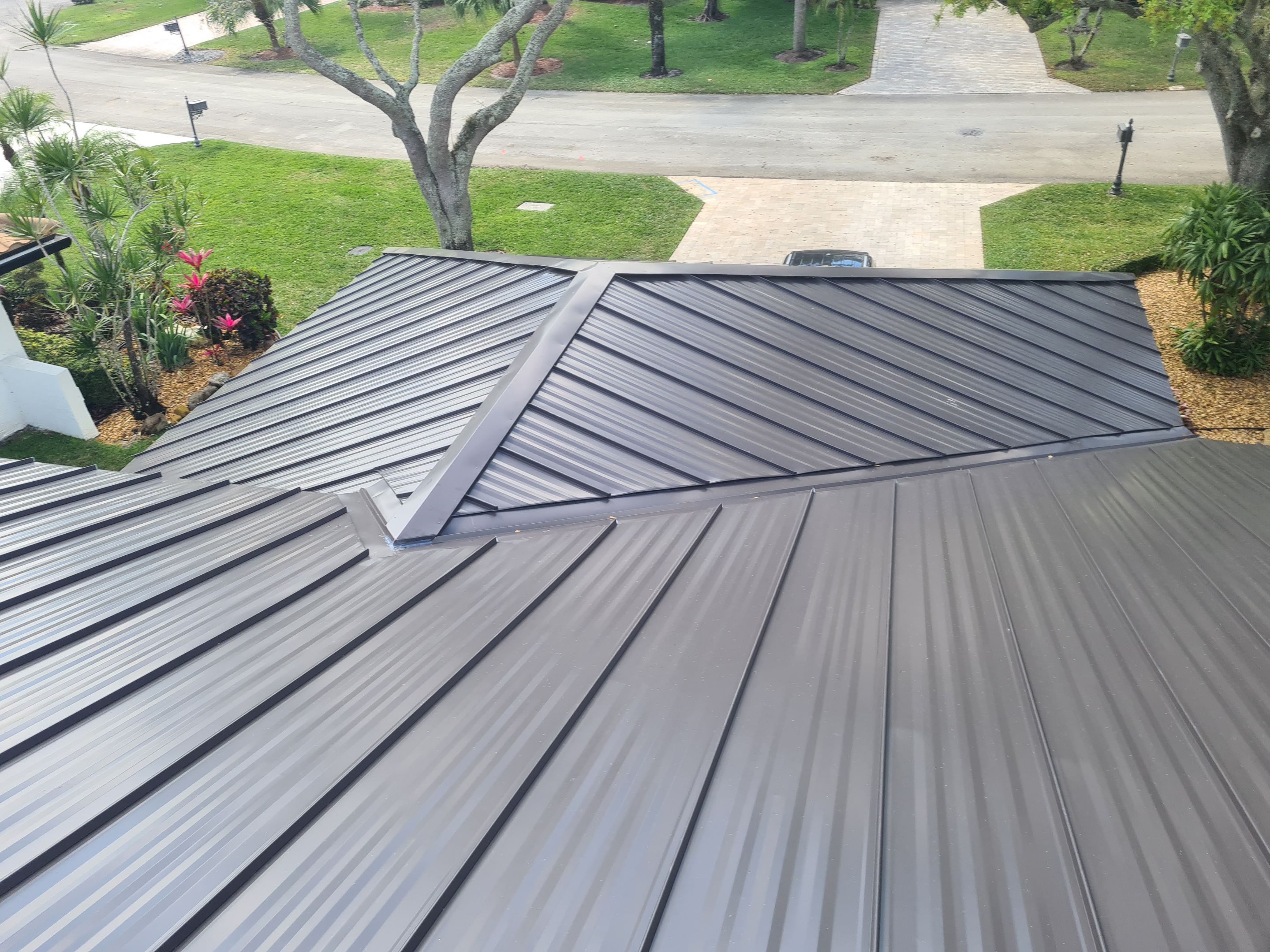 Residential Roofing Installation using 1" Nail strip metal roof by BLUES BROTHERS CONSTRUCTION CORP