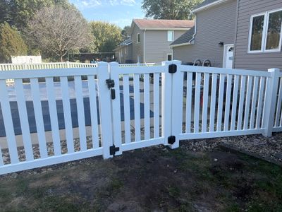 White Vinyl Picket Pool Fence Installation in Waterloo, Iowa