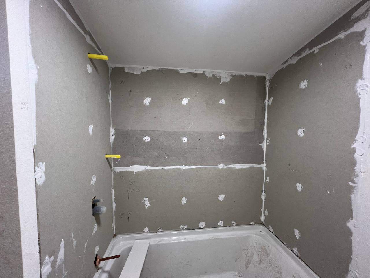 Shower wall tile by Handyman State LLC