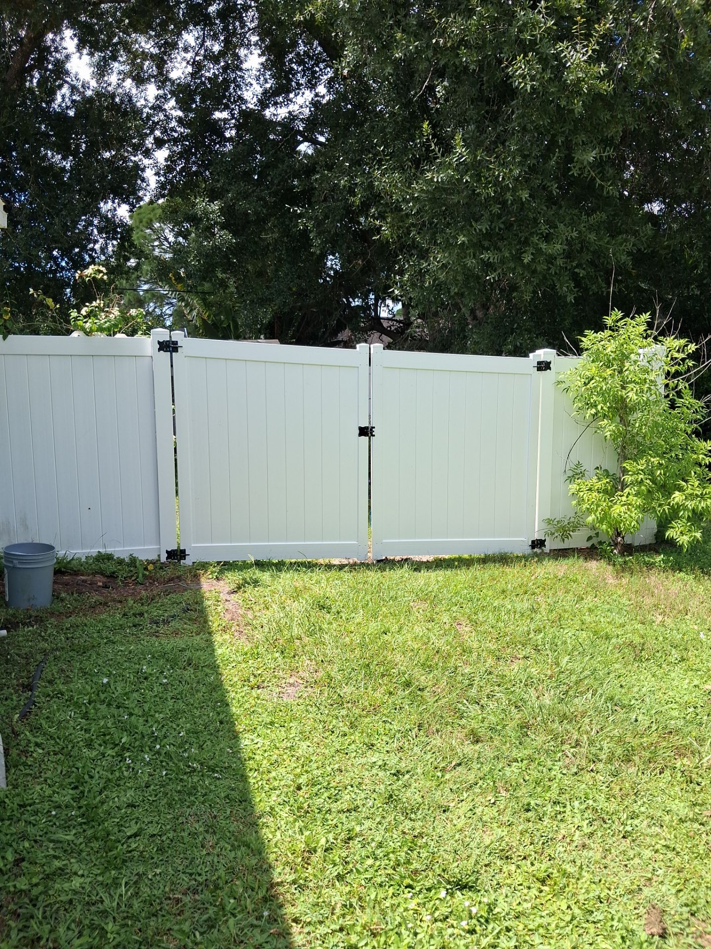 White Vinyl Privacy Fence Repair and Gate Installation in North Port by True Fence LLC
