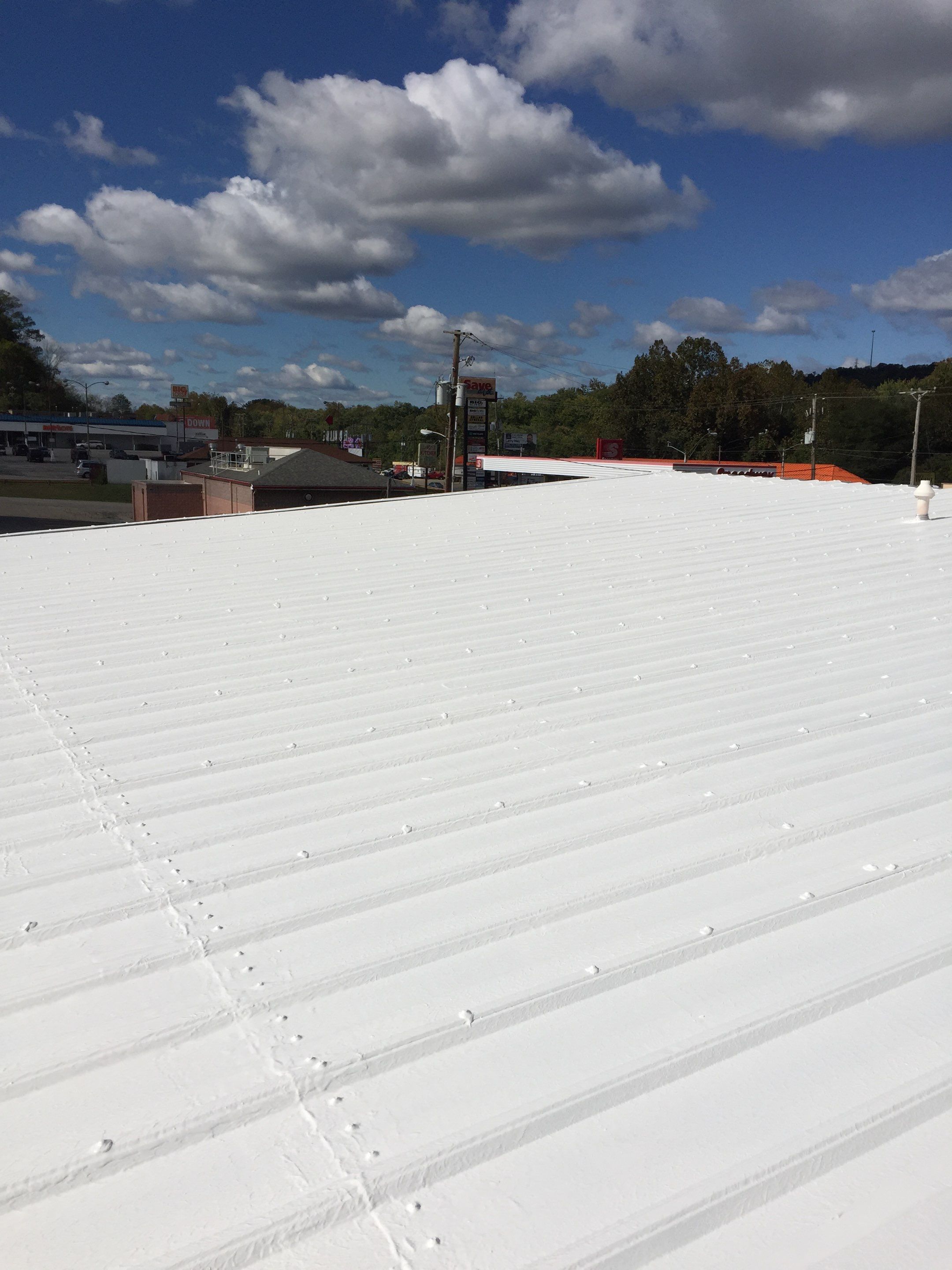 Commercial Roof Coating using Gaco Silicone Roof Coating by Secure Construction Company Inc