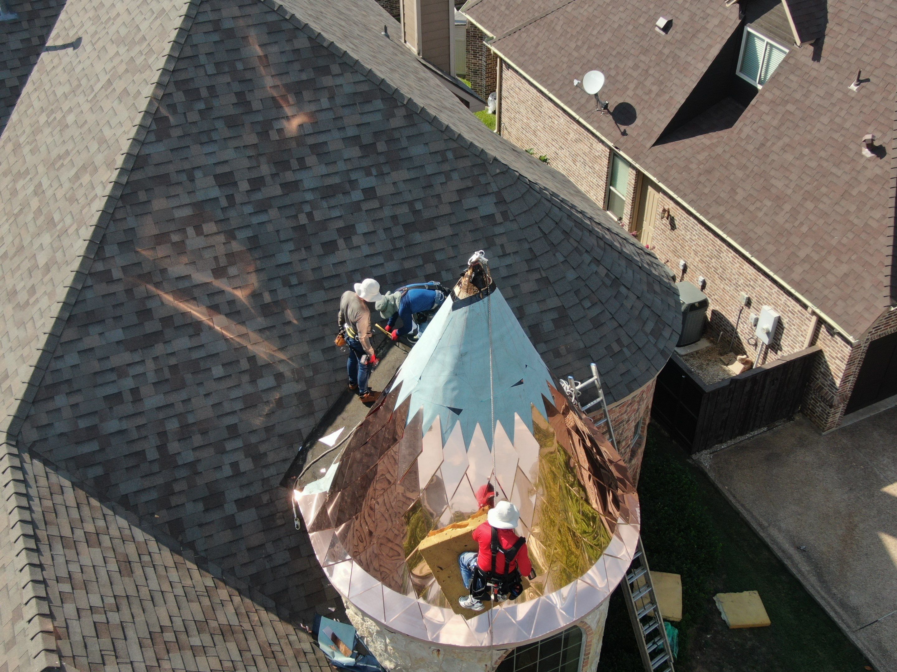 Installing Custom copper turret and Malarkey Vista Class 4 shingles Hail Damage Upgrade by Becker Roofing and Exteriors