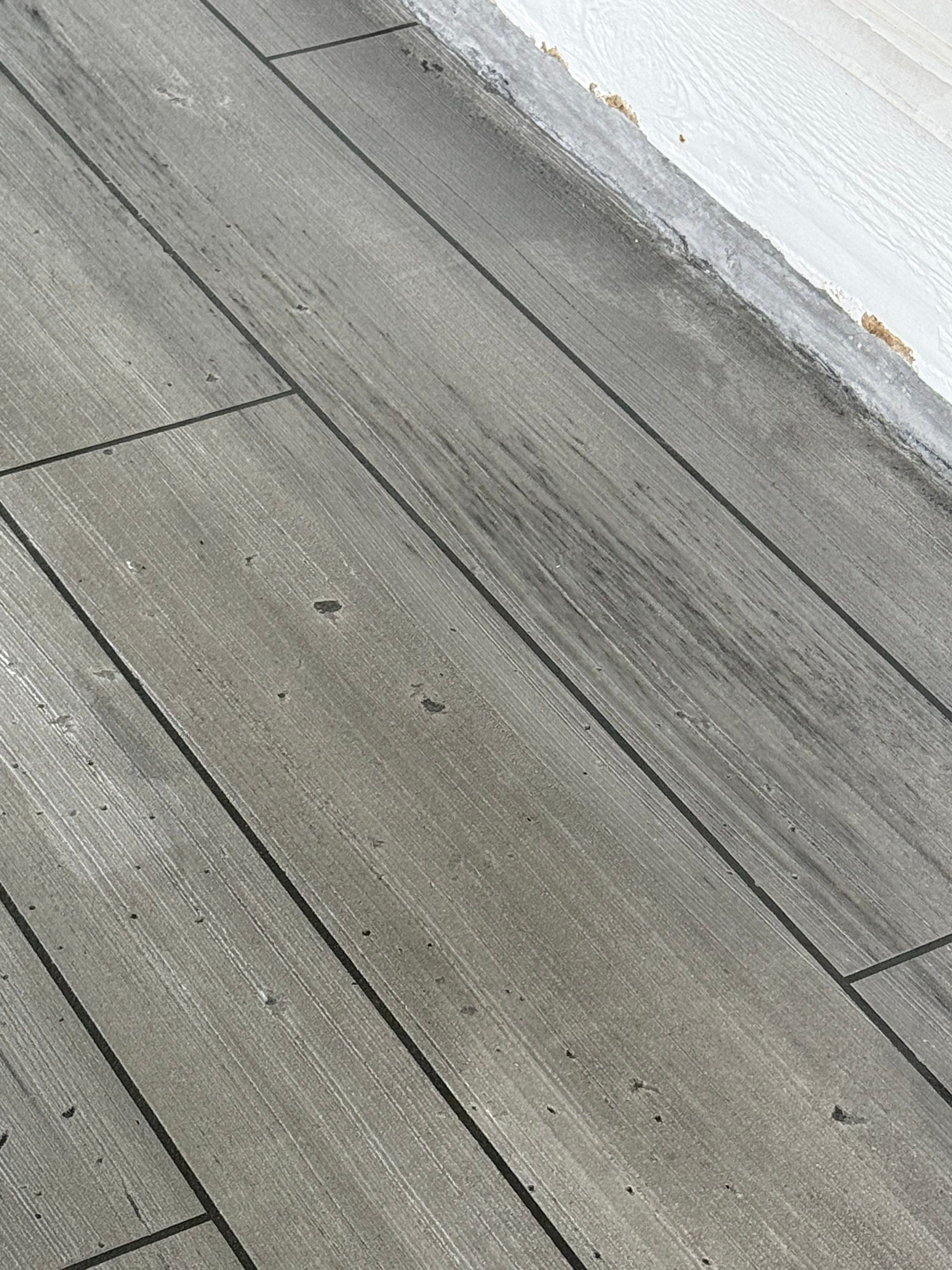 Wood-Grain Stenciled Concrete Porch Resurfacing in Mobile by Cornerstone Hard Surface Restoration 