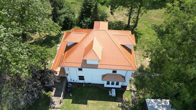 Residential Roofing Installation using Performance Panel Metal - Copper Metallic