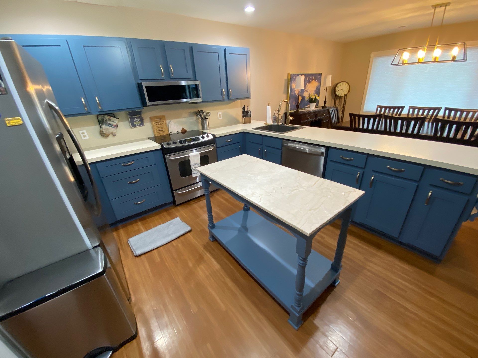 Blue-Grey Kitchen Cabinet Refinishing Transformation in White Lake by Top Shelf Painter