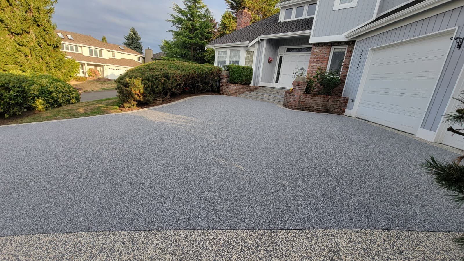 Elegant Driveway and Patio in Palazzo Vuba Stone by Concrete Coating Experts Inc.