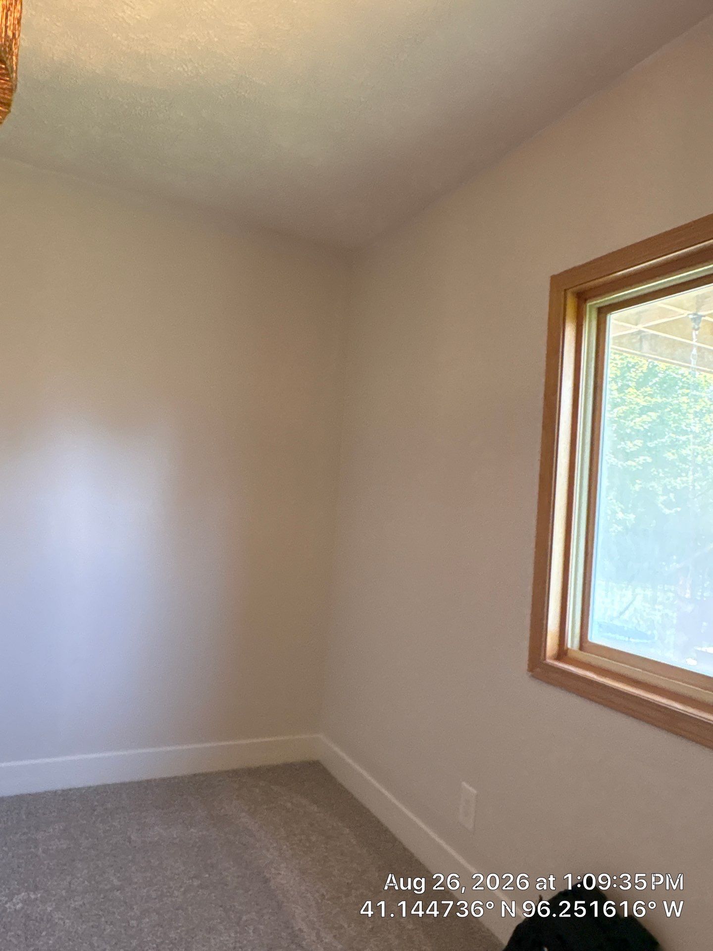 Residential Sliding Window Installation With Natural Wood Trim by CompanyCam Sales Demo