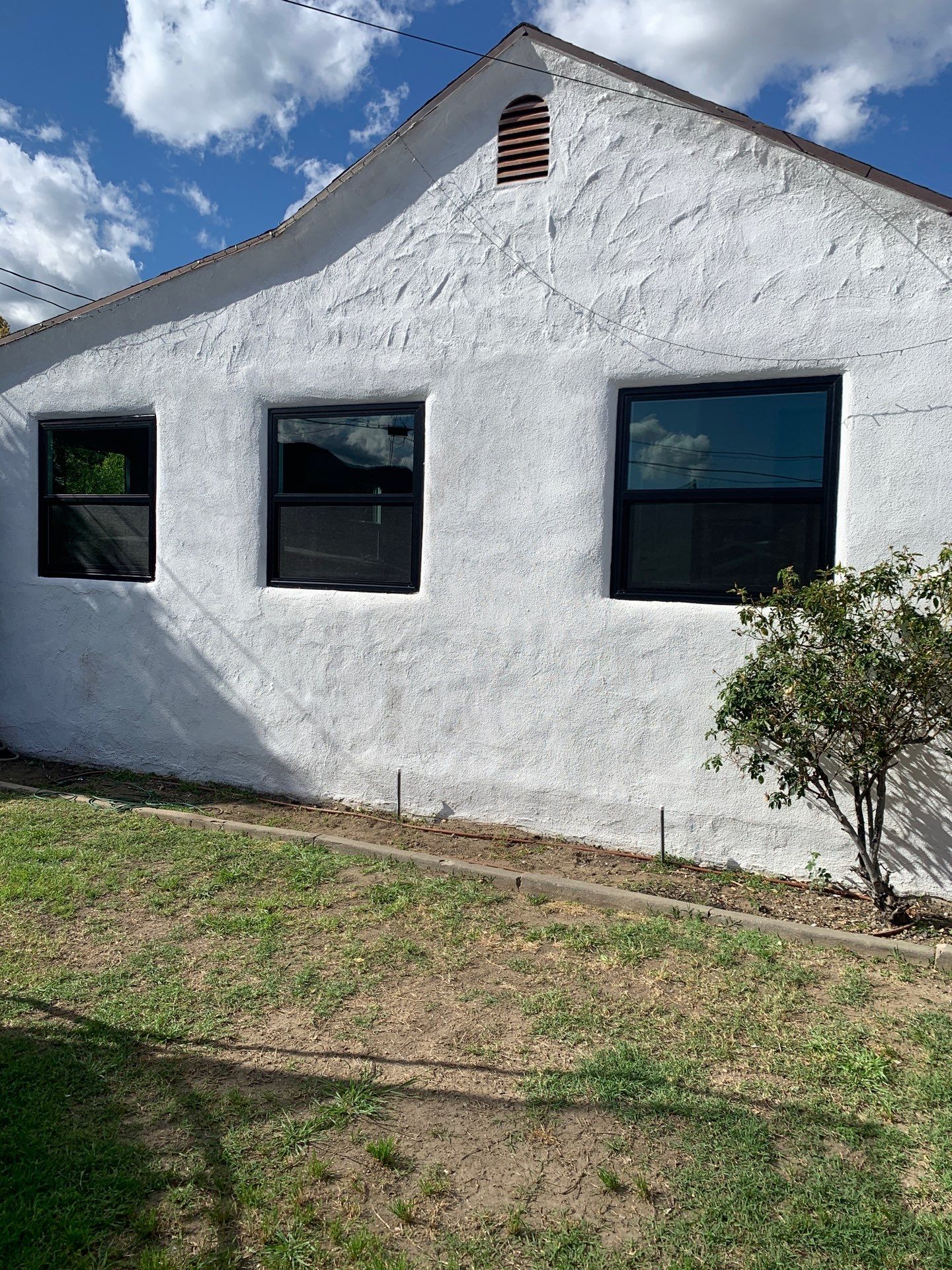 Window Installation using Black Anlin windows by American Window Company