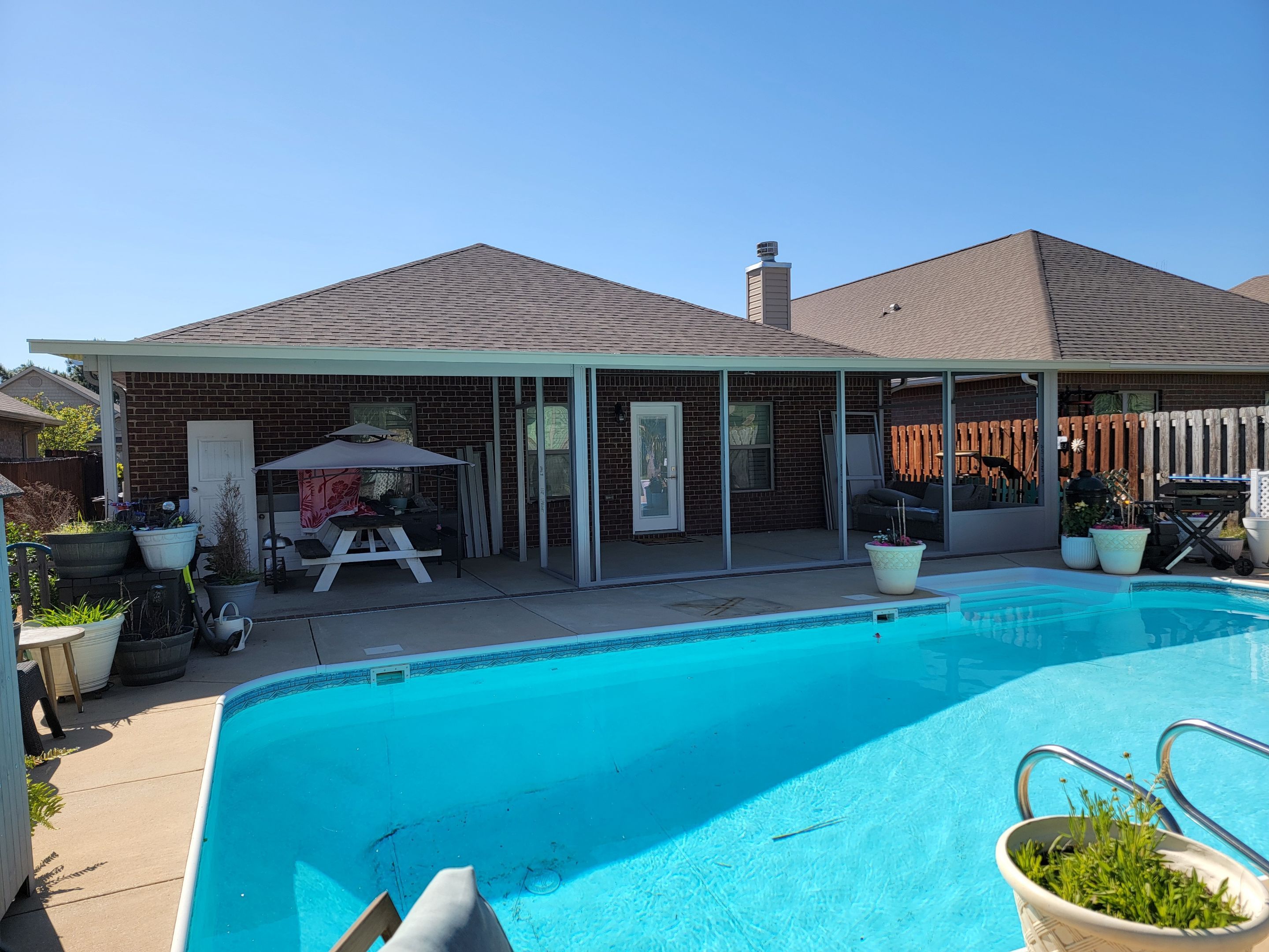 Poolside Screen Room & Patio Cover in Gulf Breeze by Titan Sunrooms