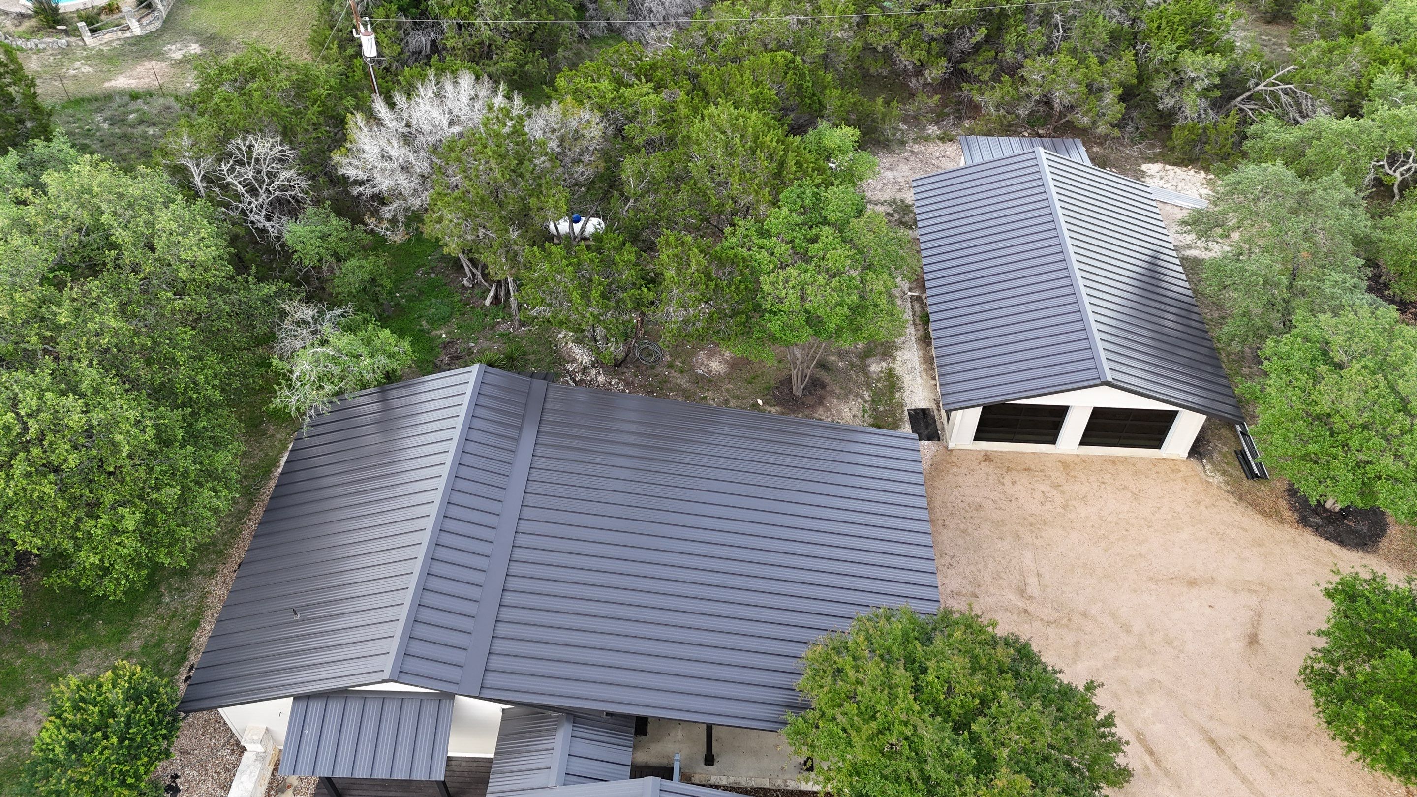 Dark Bronze Fully Striated panel by Wimberley Roofing