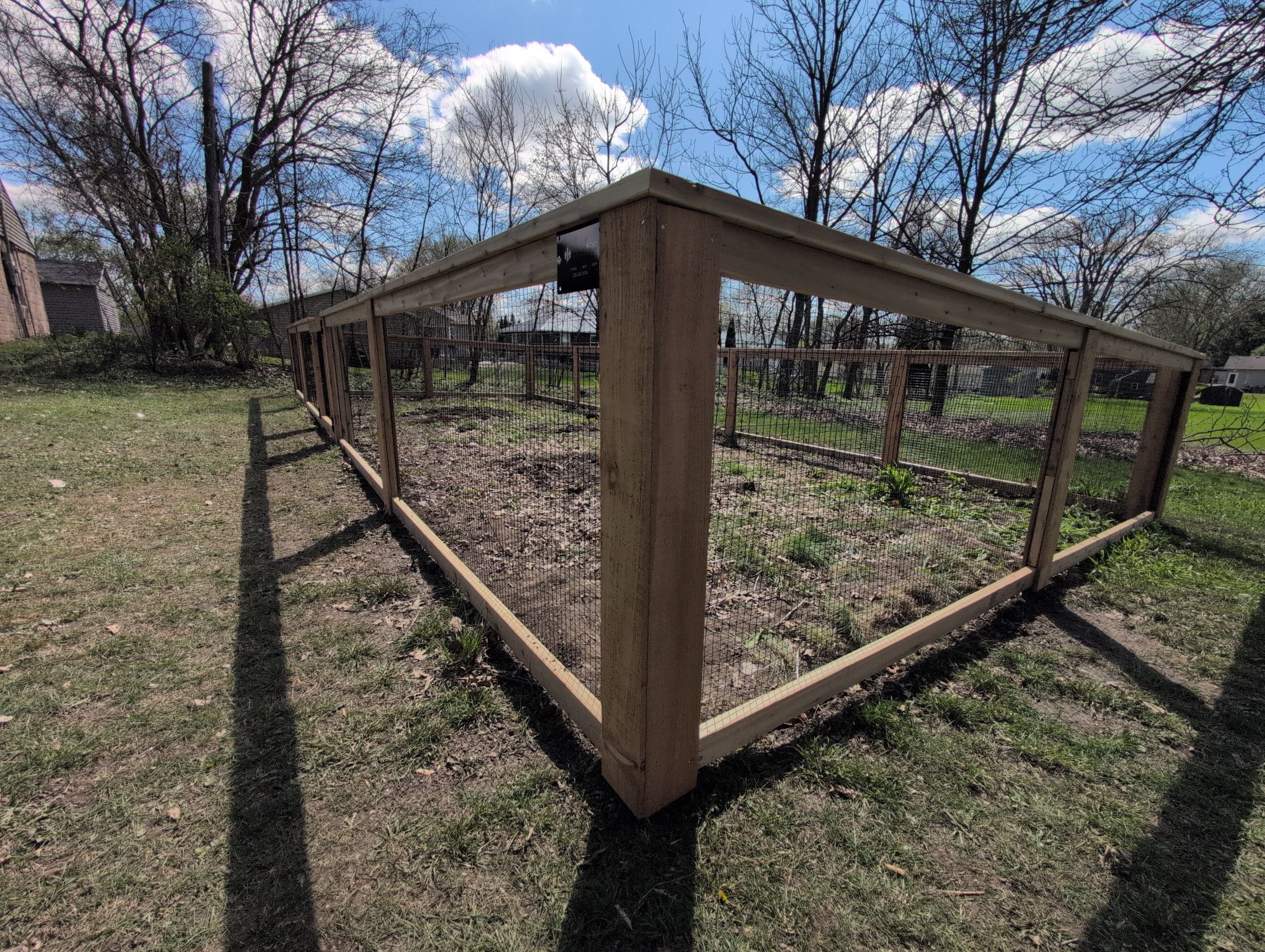 Custom Cedar Wood Garden Fence Installation in Cedar Falls by Perfect Picket Fence and Stain