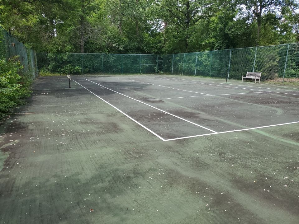 Tennis court cleaning by Northern Power Washing LLC.