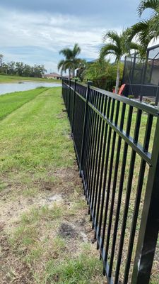Aluminum Fence Installation using Black 3 Rail Aluminum Fence