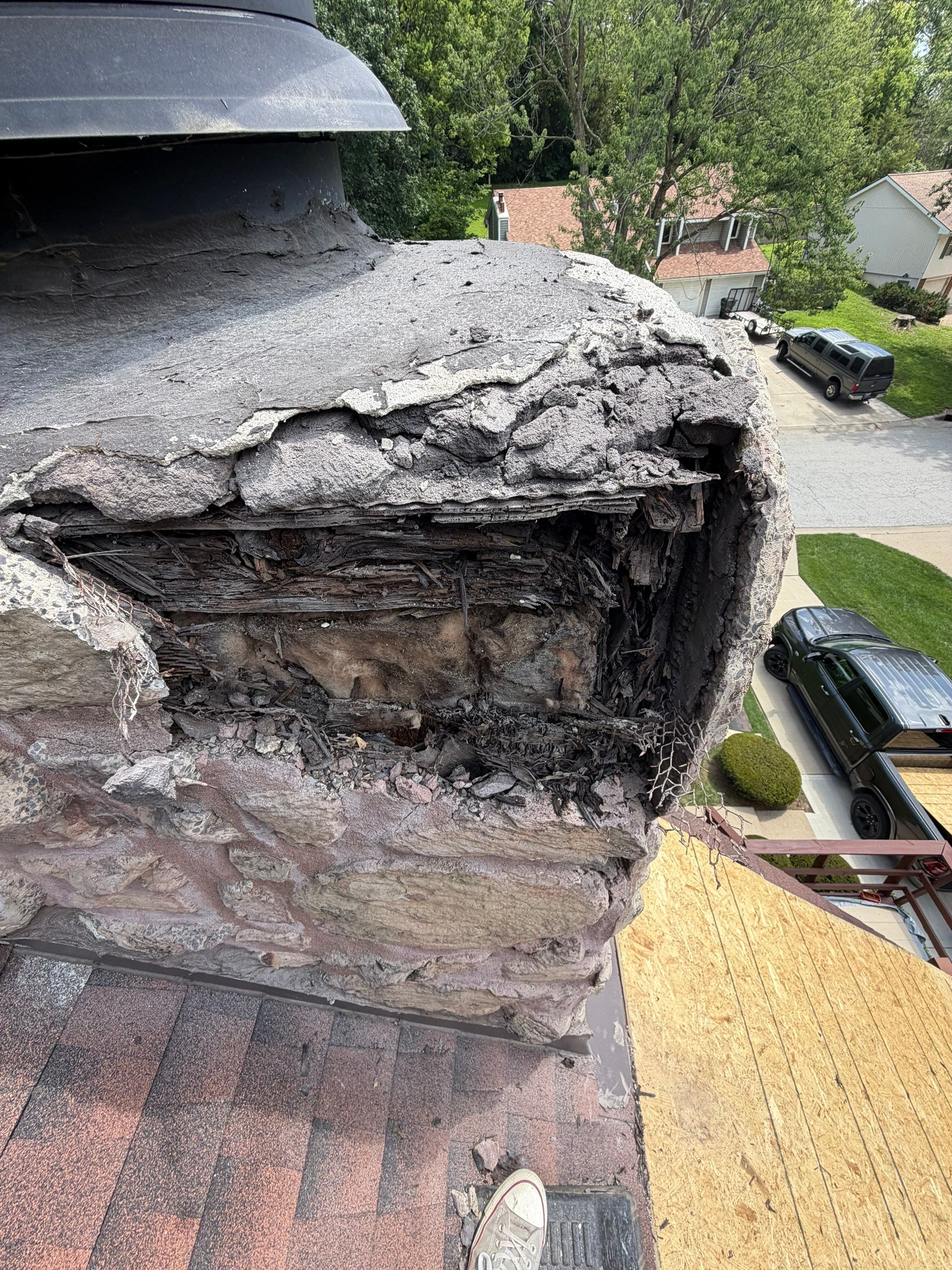 Structural Stone Chimney Restoration and Roof Repair in Leavenworth by Summit Roofing