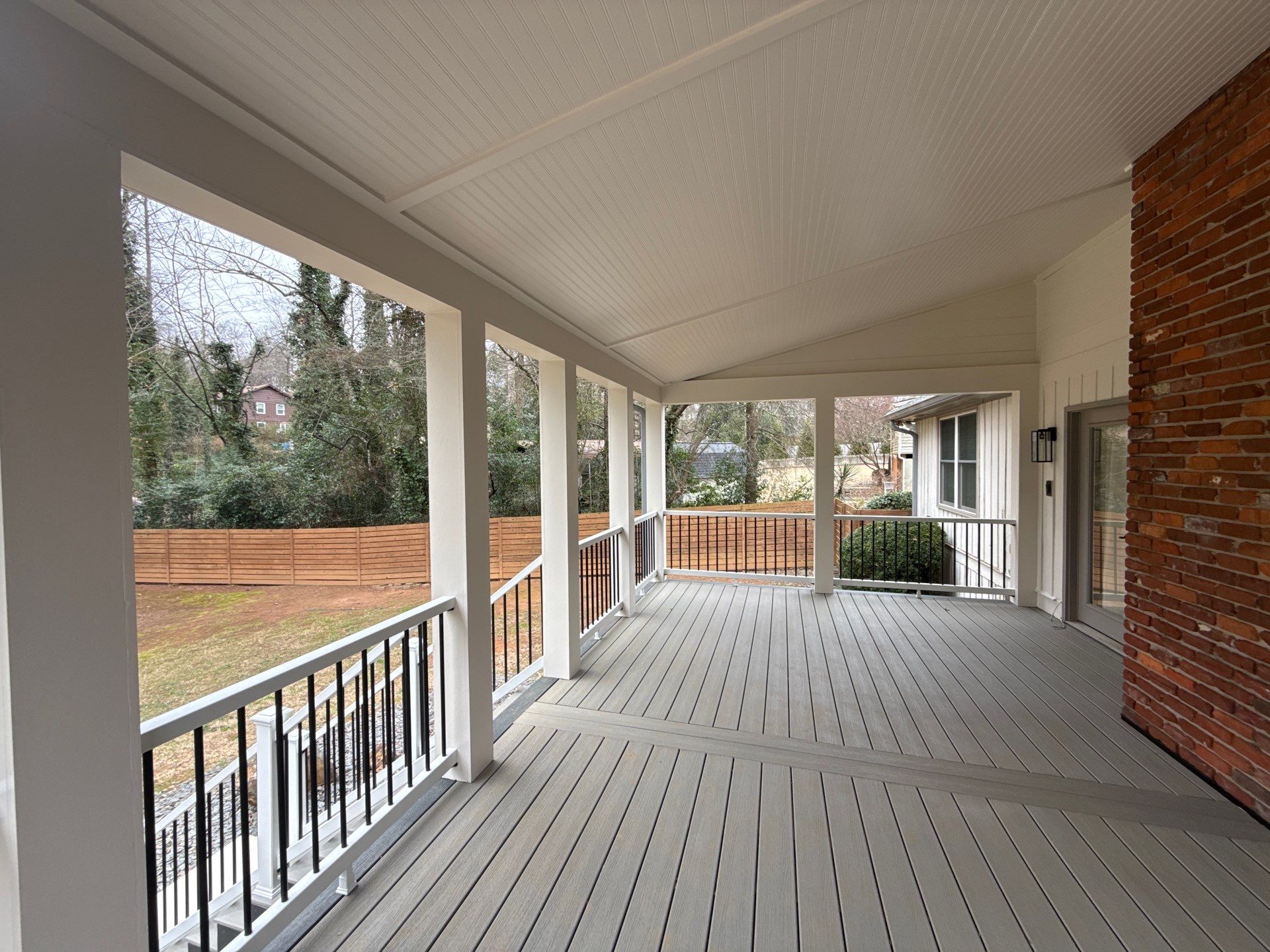 Deck and Shed Roof Style Covered Build using Trex Decking Products by Nelson Exteriors 