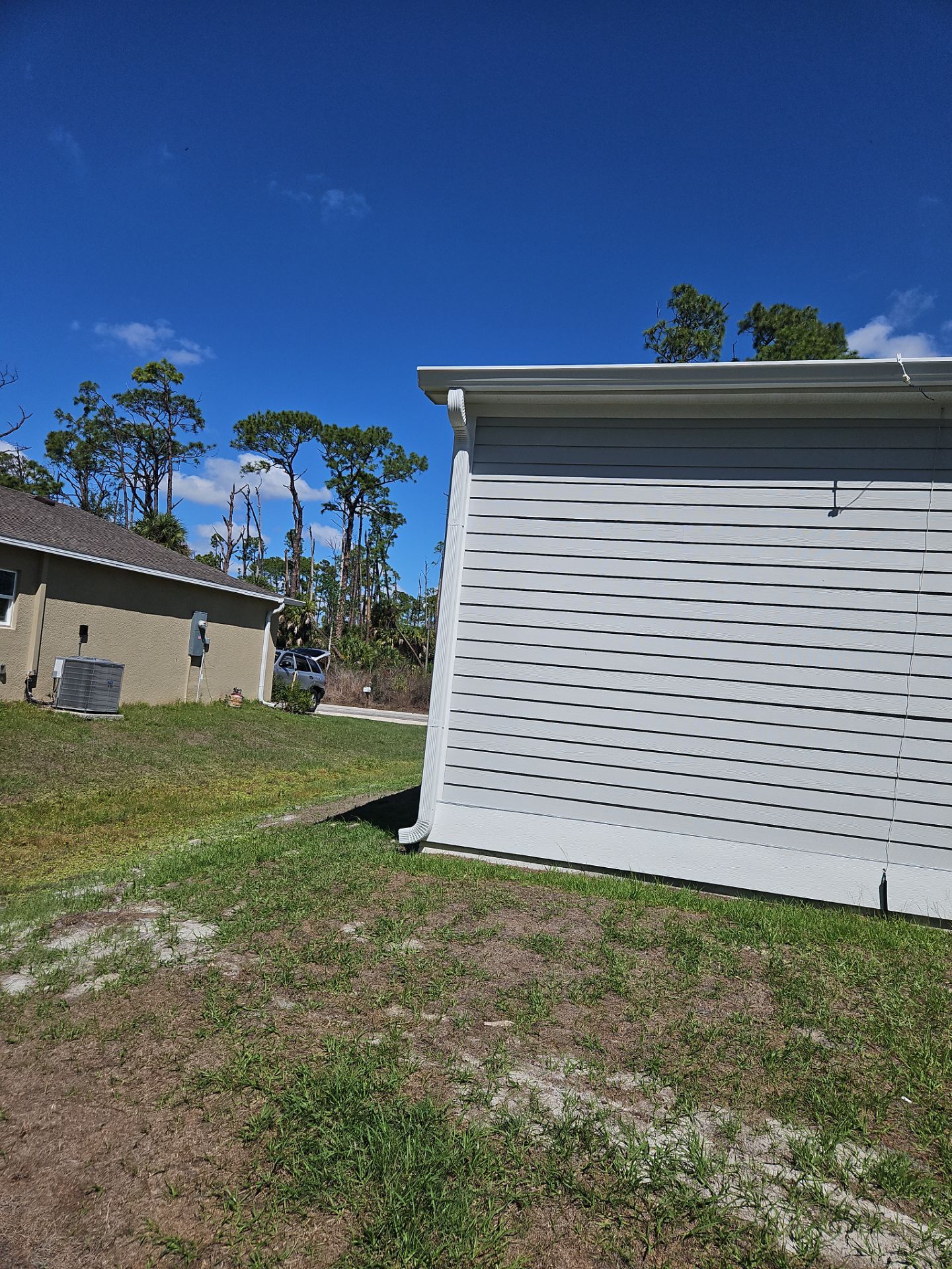 Downspout Installation using 3X4 Elbow Downspout in Port Charlotte FL by Gutter Professors