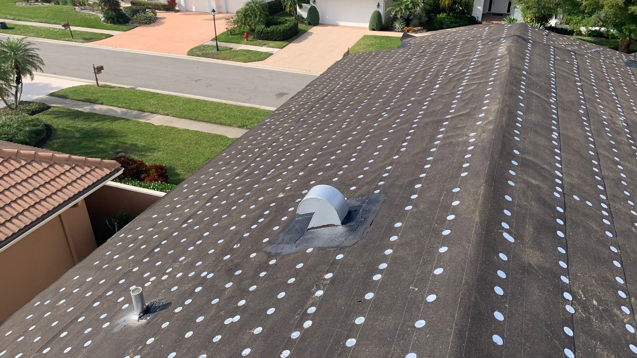 Residential Roofing Installation using 1" Nail strip metal roof by BLUES BROTHERS ROOFING