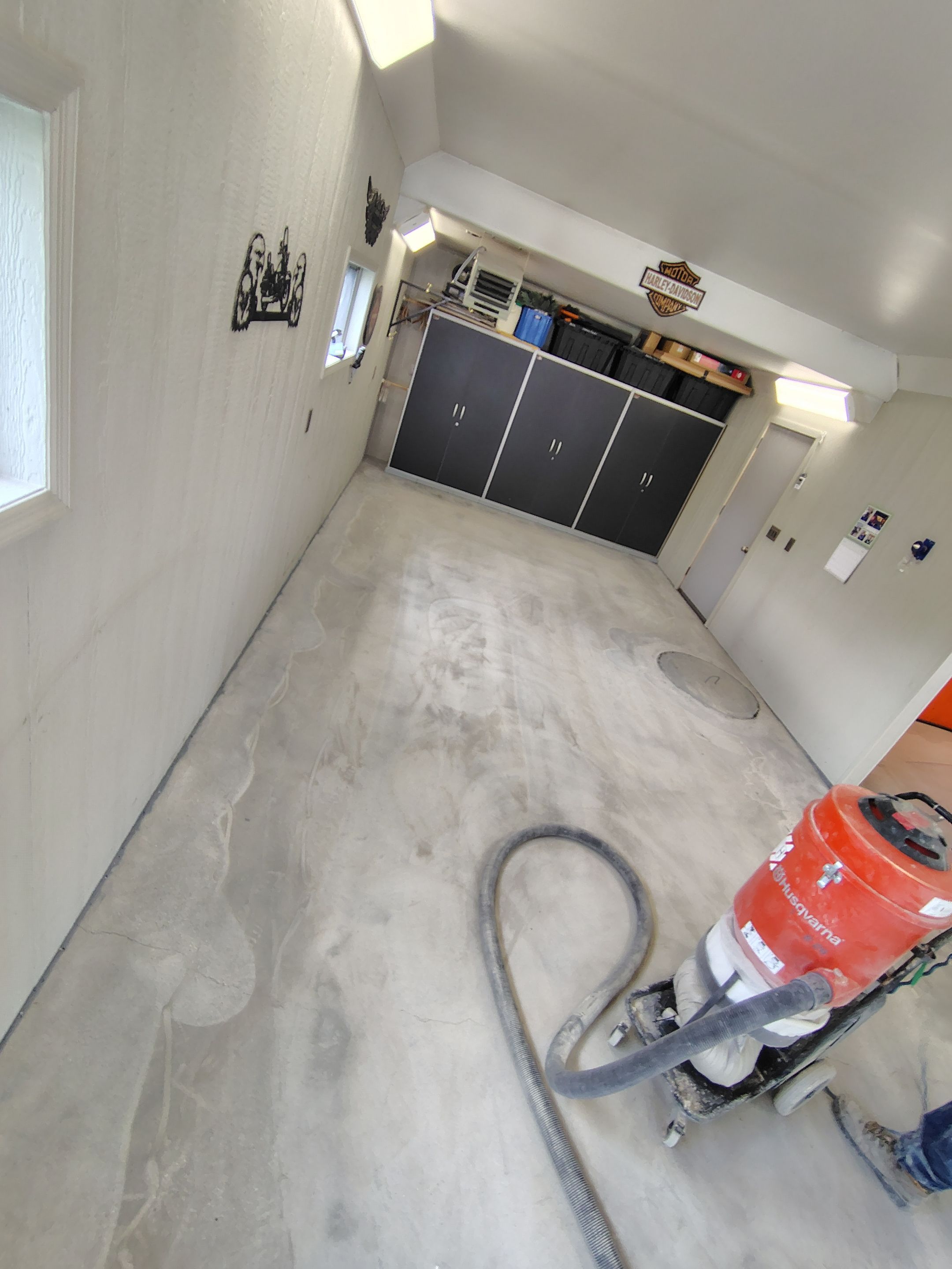 Custom Grey Flake Epoxy Garage Floor Installation in Remsen by Select Painting, Coatings & Garage Cabinets
