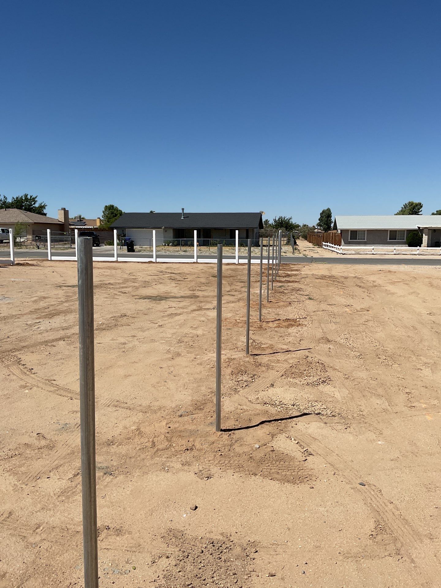 6ft White Privacy Vinyl Fence with Chain-link Fence by Fence Guys Inc.