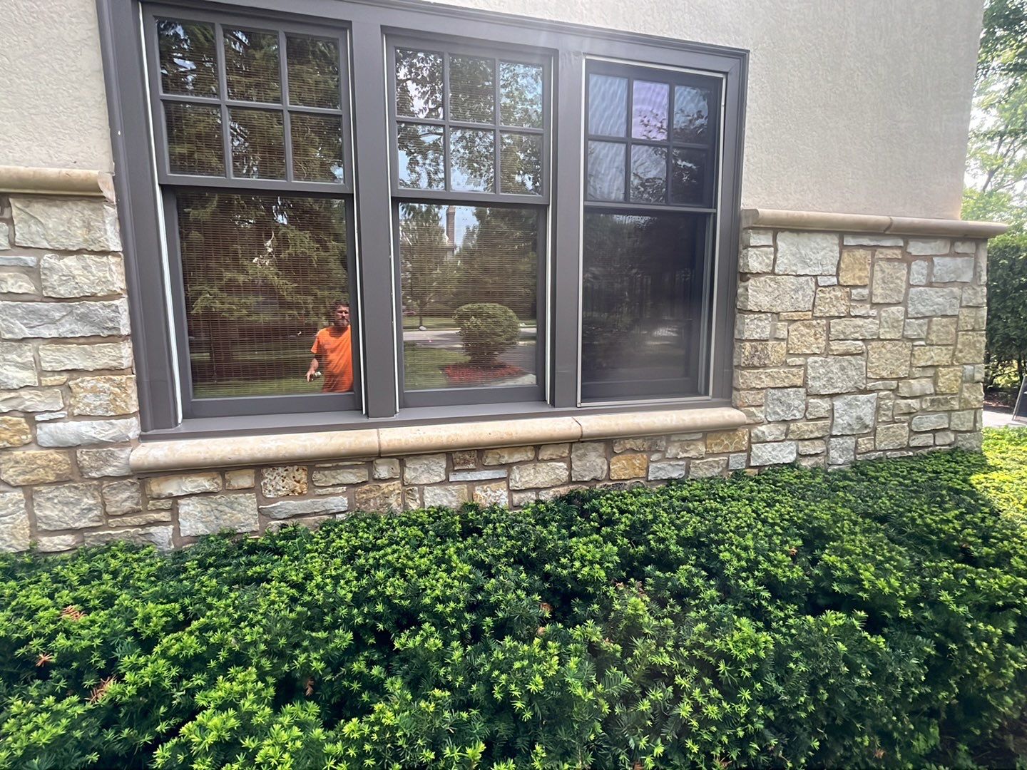 Northbrook, IL stucco home soft wash and stone cleaning by Northern Power Washing LLC.