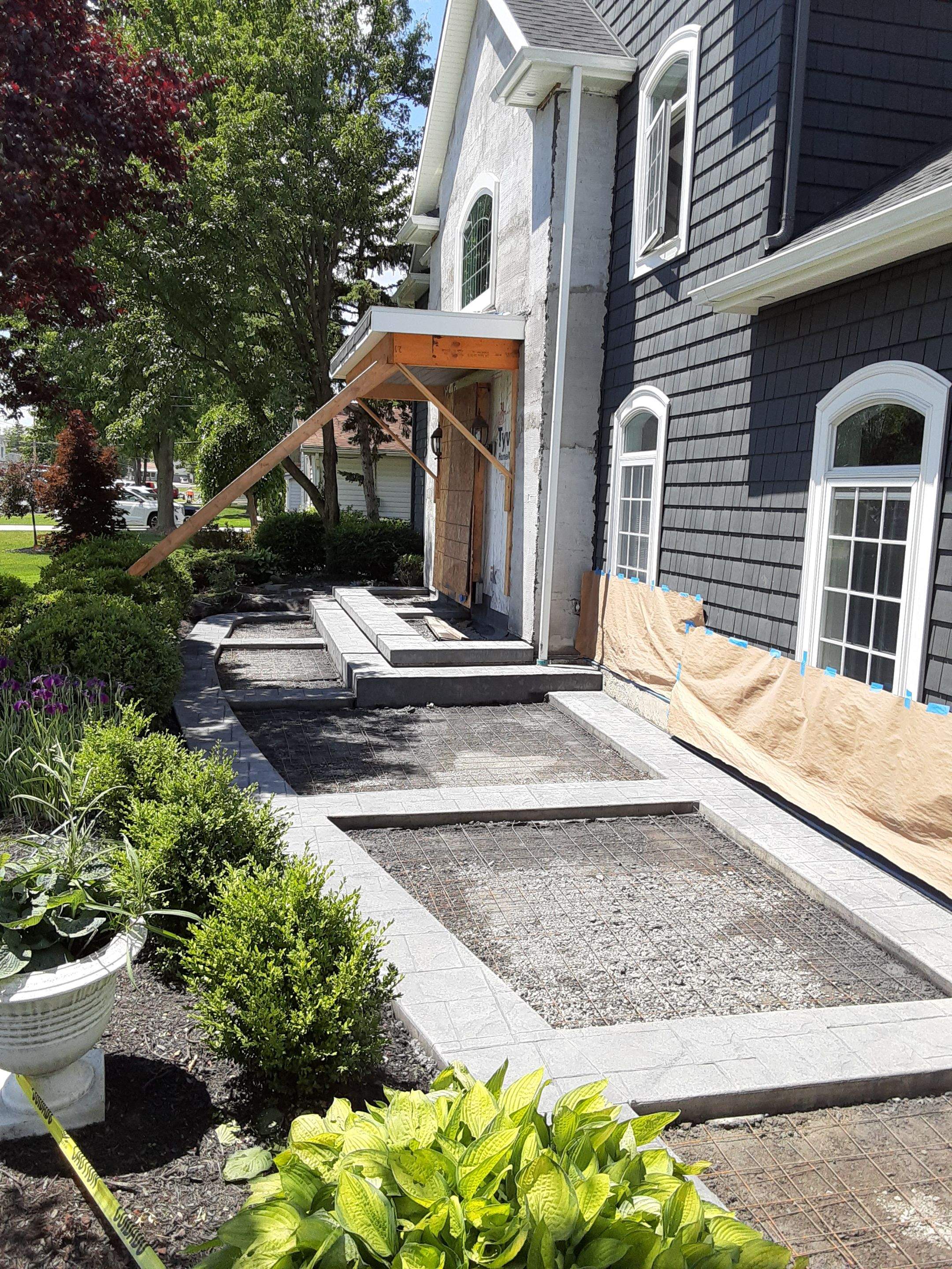Exterior Renovations- Siding, Concrete, Railings, and Entry Door  by Ivy Lea Construction