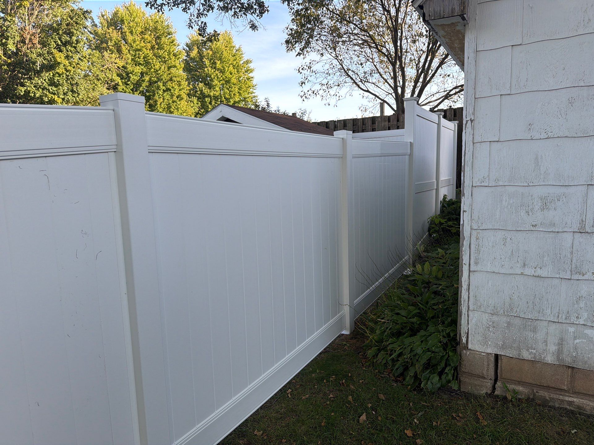 White Vinyl Privacy Fence and Gate Installation in Grundy Center by Perfect Picket Fence and Stain