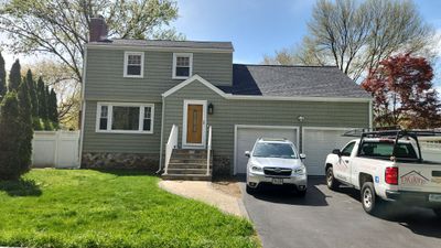 Refreshing siding upgrade with Cert Cedar Impressions D/7 straight bottom perfection, Cypress and Cert Monogram D/5 Dutchlap, Cypress