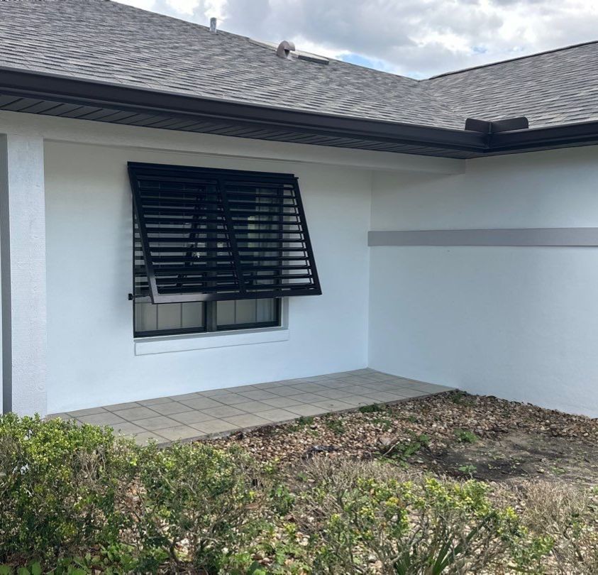 Bahama Shutters in Grey Brown by Smart Guard Shutters