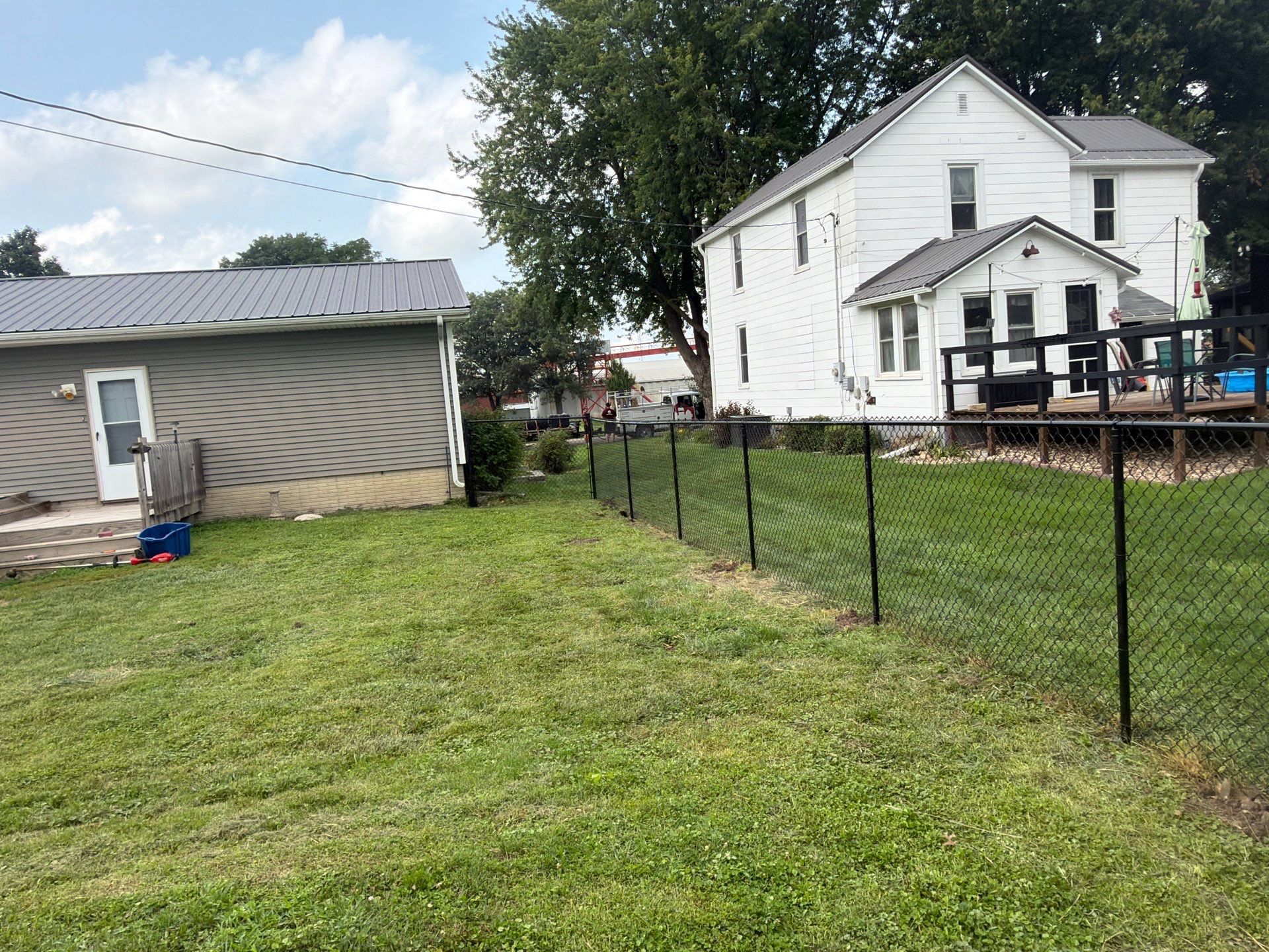 Residential Black Chain Link Fence Installation in Reinbeck by Perfect Picket Fence and Stain