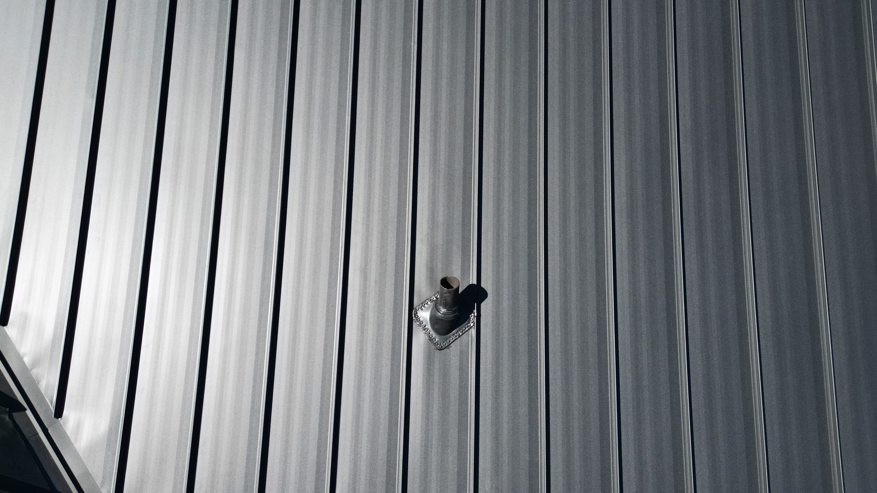 Commercial Roofing Installation using Standing Seam Metal - Frost Black by RoofX 