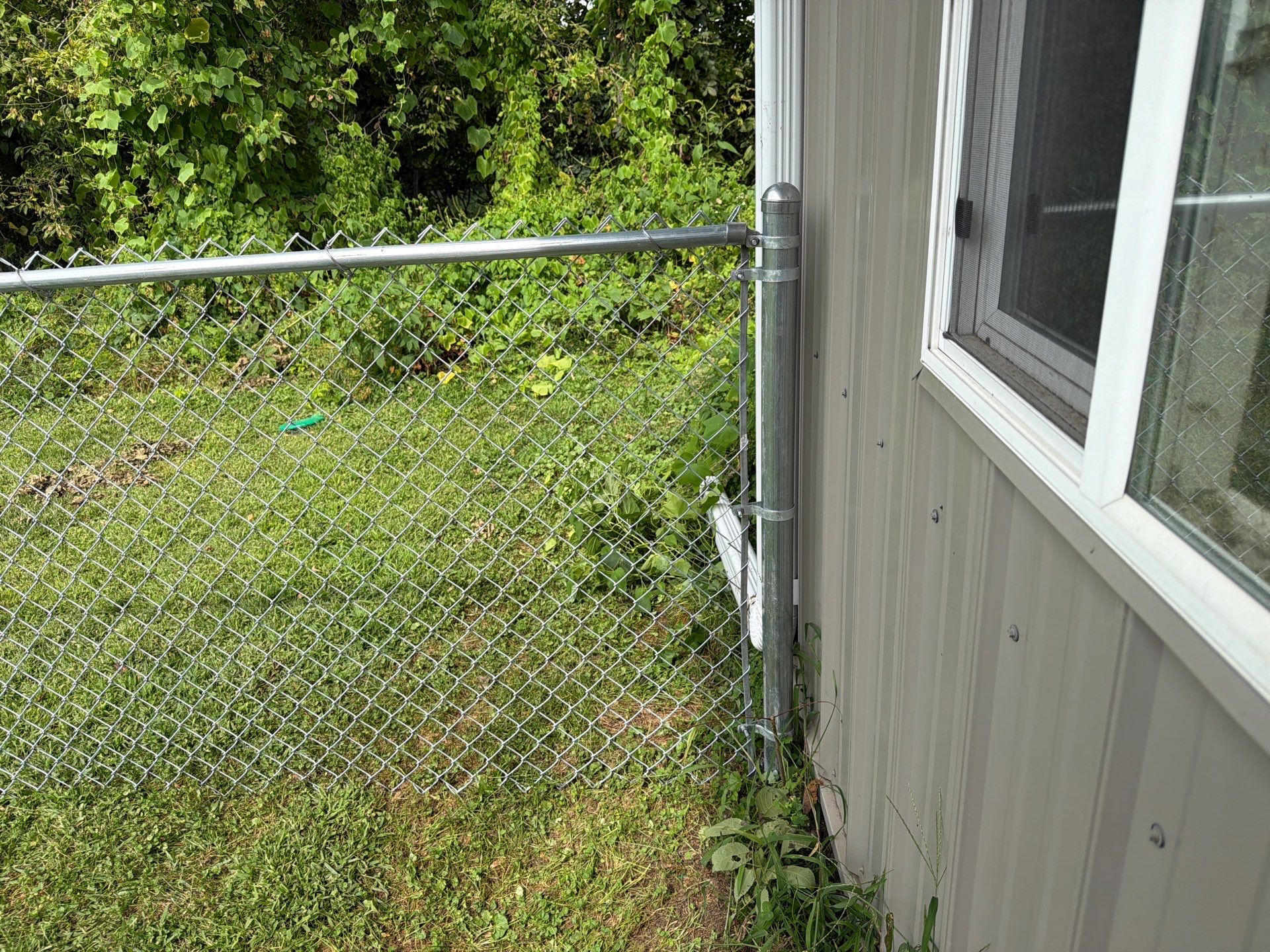 Galvanized Chain Link Fence and Gate Installation in La Porte City by Perfect Picket Fence and Stain