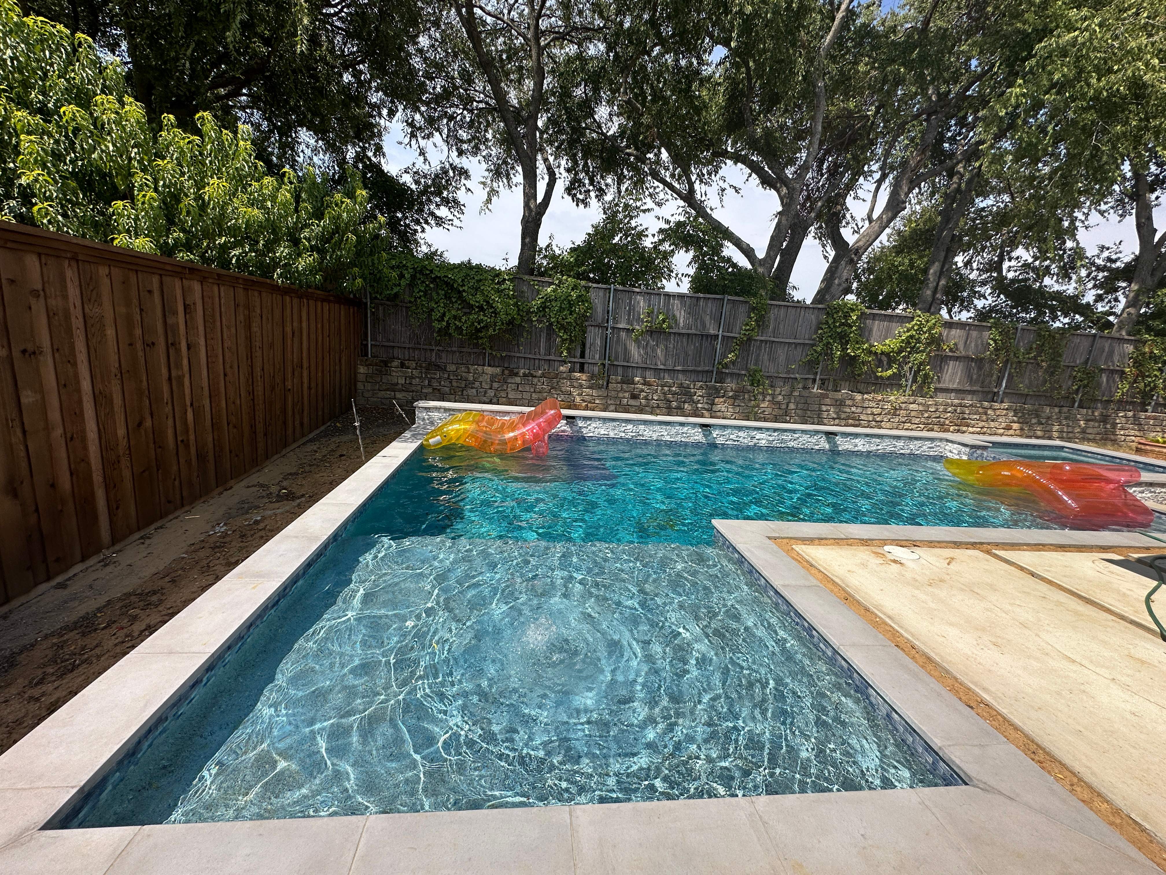Geometric Pool with Raised Spa and Stone Decking by Pinnacle Pools and Spas - DFW