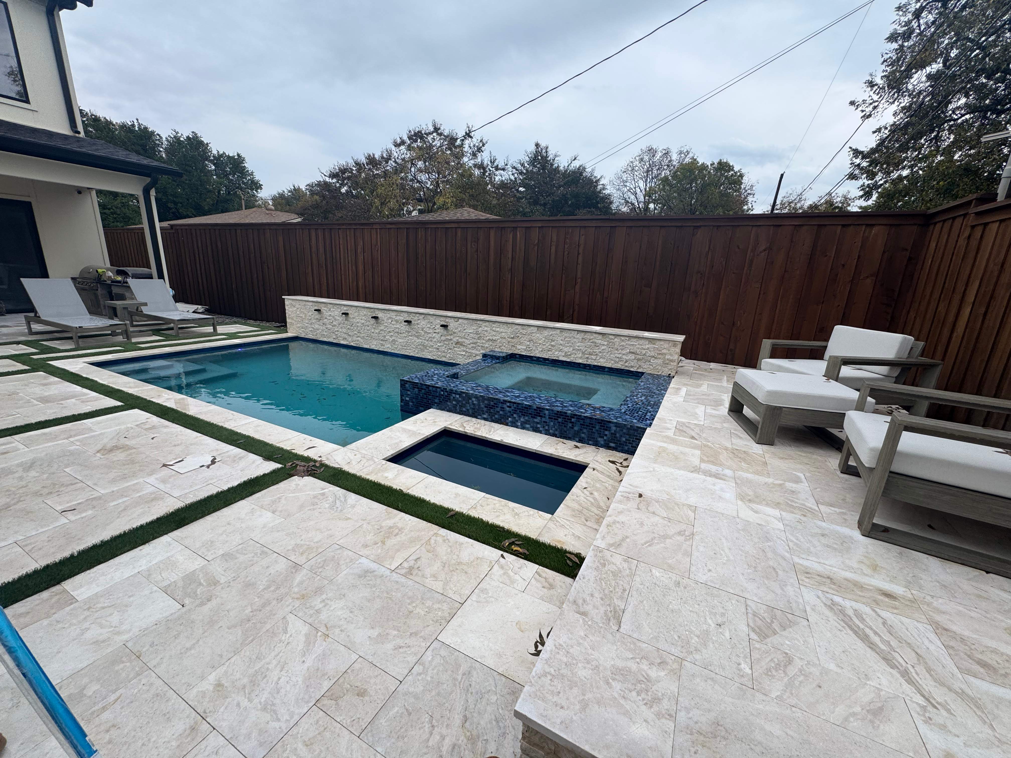Modern Geometric Pool and Spa with Turf-Strip Decking by Pinnacle Pools and Spas - DFW