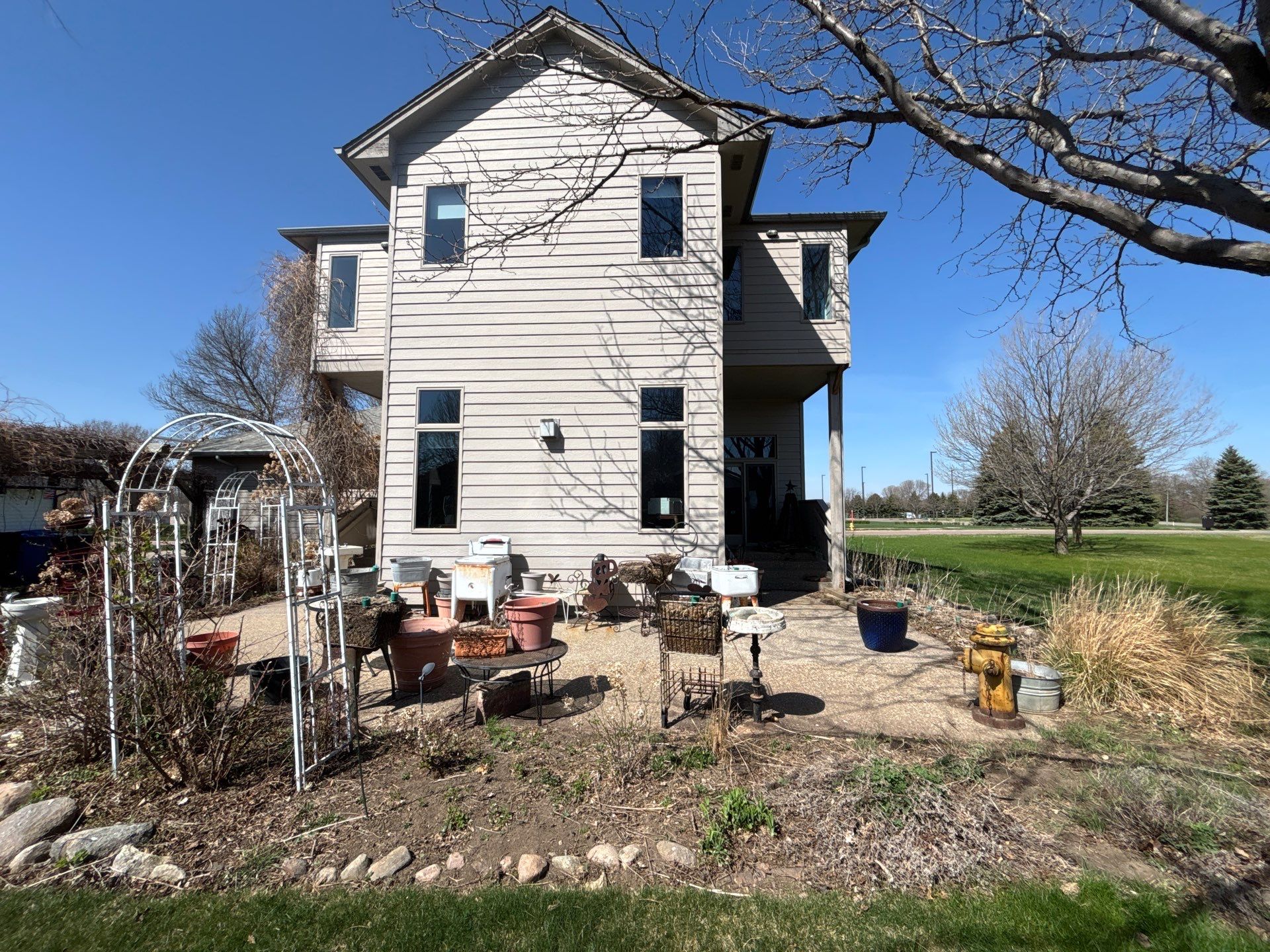 Exterior Siding and Trim Painting for Sioux Falls Residence by Select Painting, Coatings & Garage Cabinets