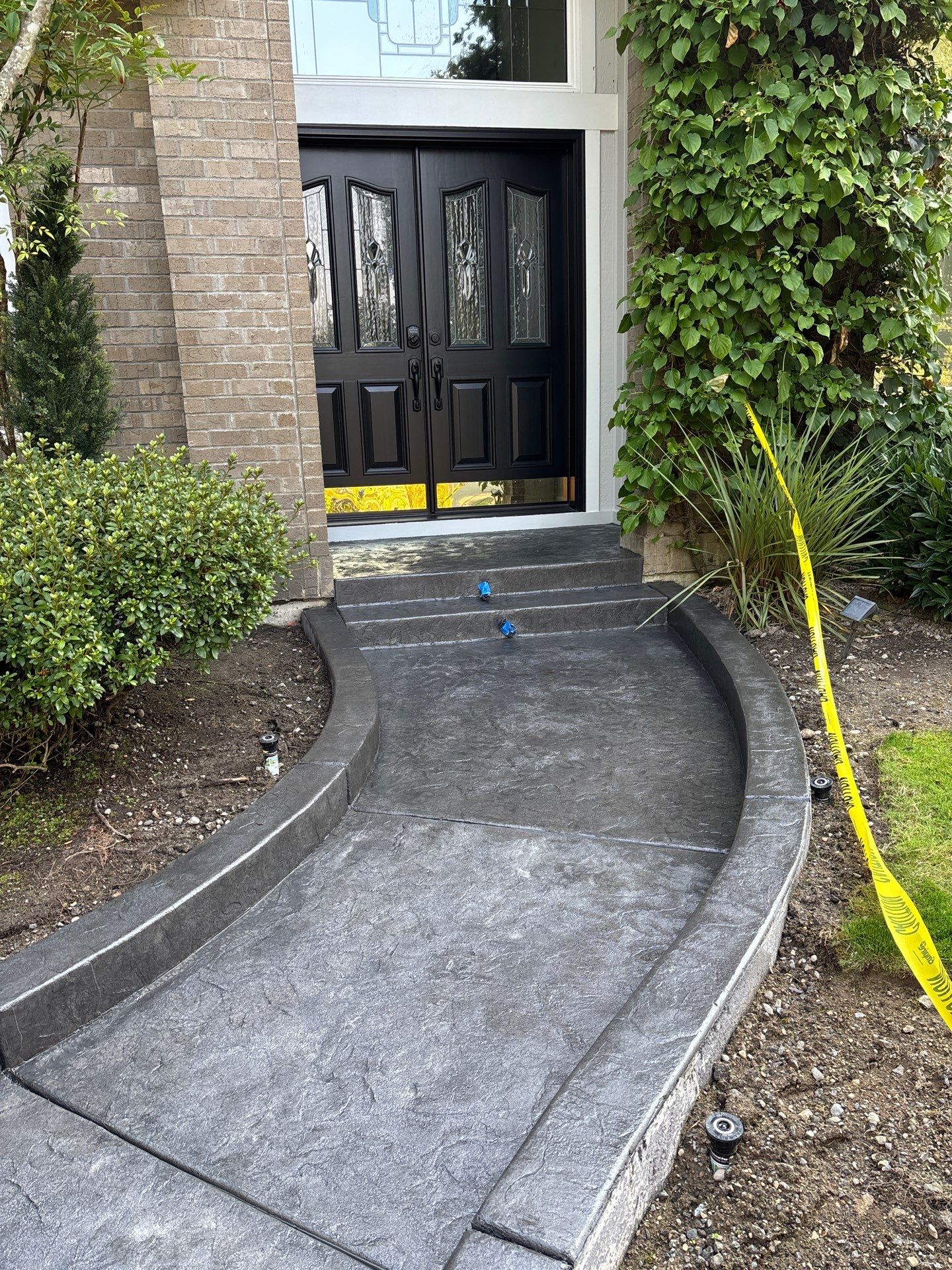 Multi-color Stamped & Sealed Concrete Driveway Renovation | Mukilteo by Jireh Asphalt & Concrete Inc