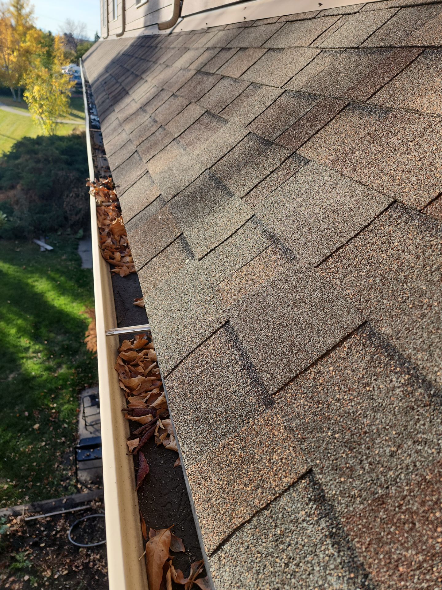 Commercial gutter cleaning Missoula, MT before photo with filled gutters