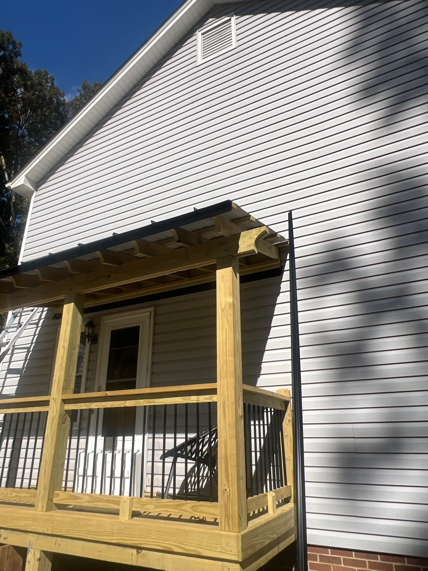 Custom Pressure-Treated Deck and Metal Roof Installation in Durham by The Remodeling Company