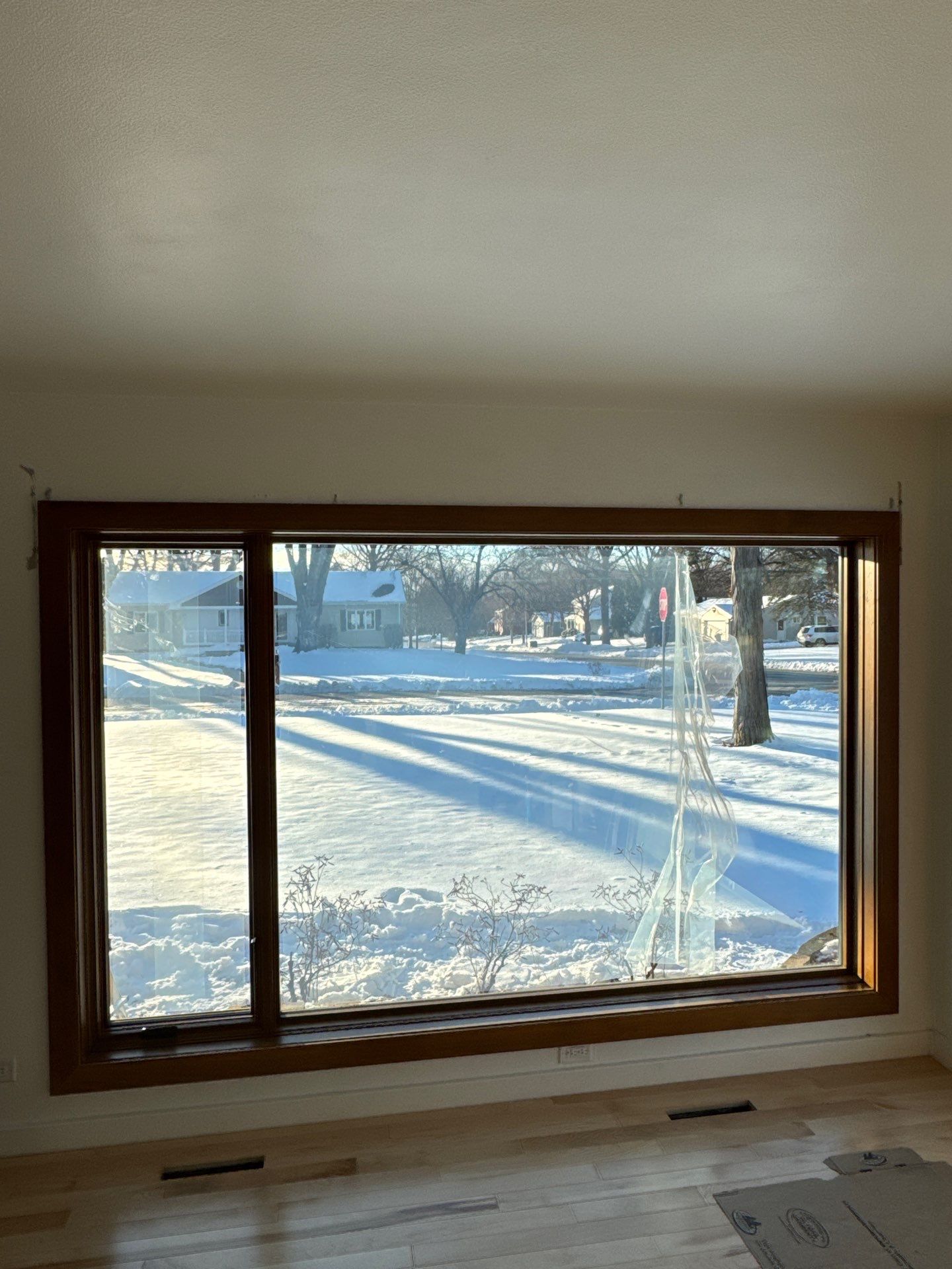 Black-Frame Pella Lifestyle Upgrade on a Partial Brick Home by United Windows and Siding LLC