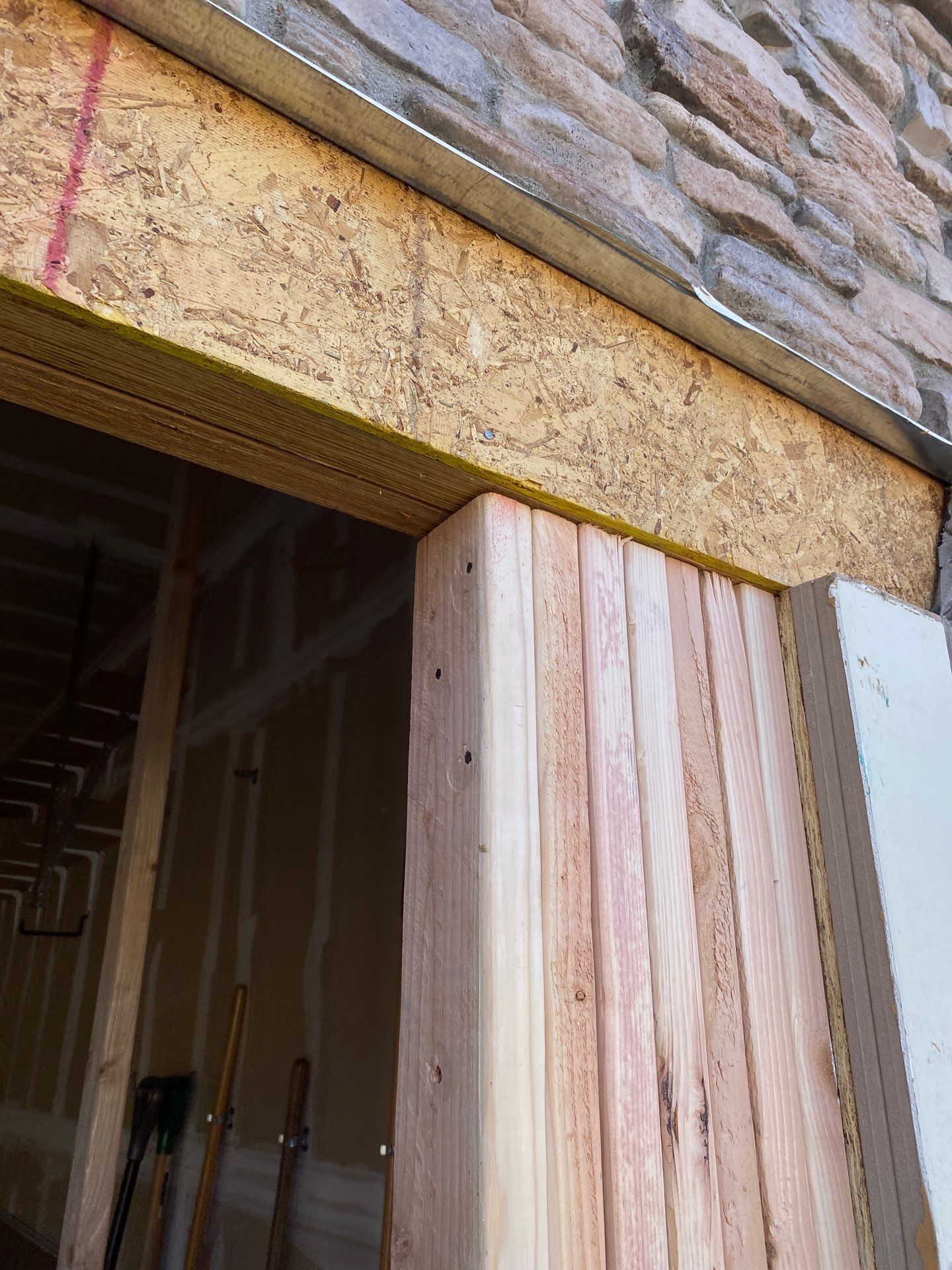 Garage door conversion by David & Goliath Contracting 