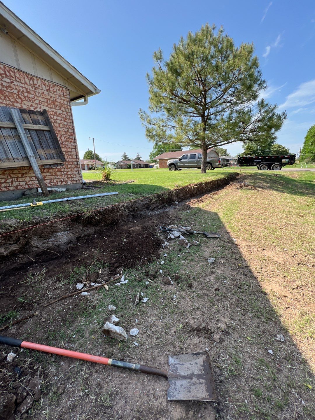 Retaining Wall using Rocks by Clays Services Inc