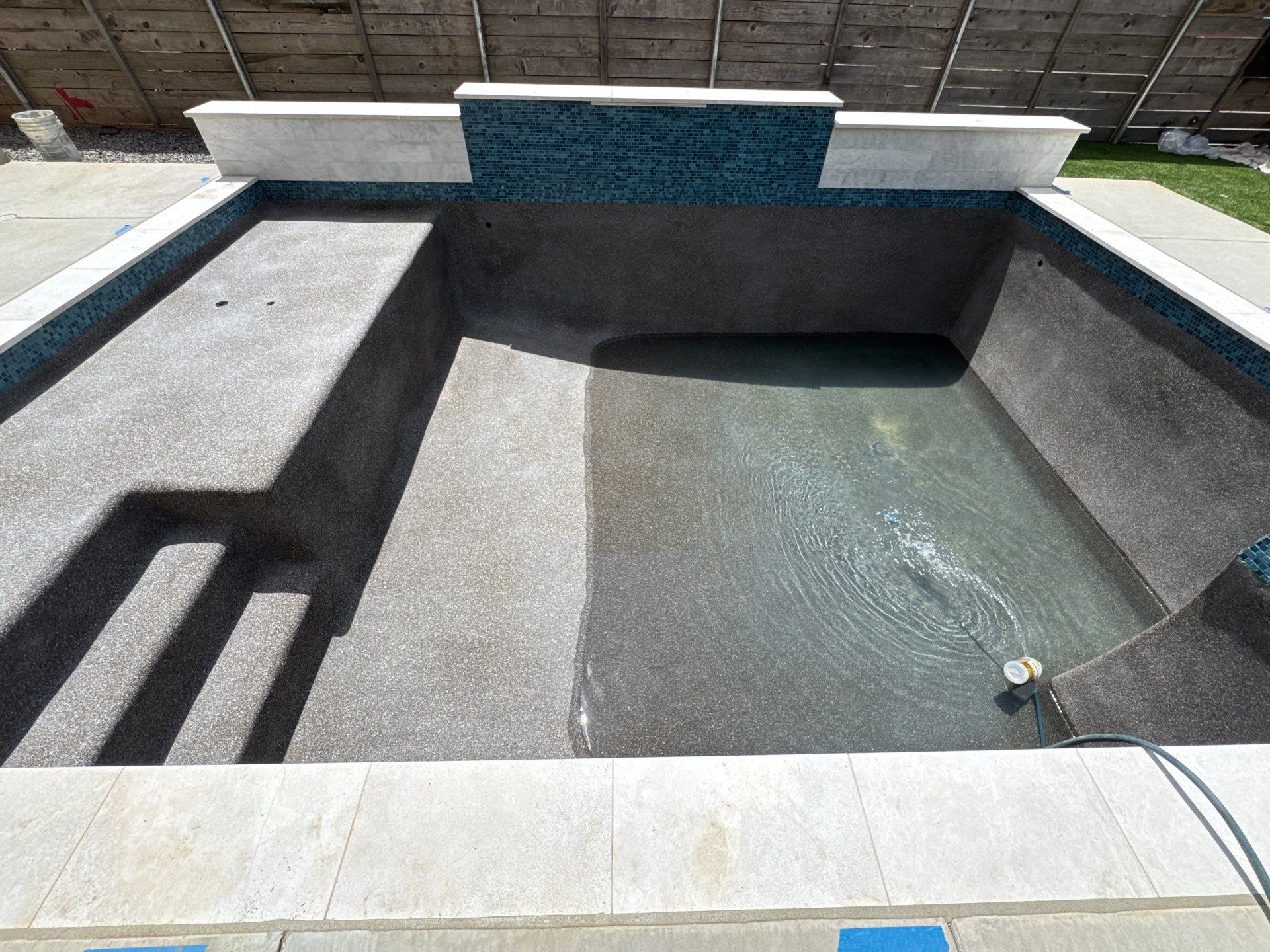 Modern Pool with Raised Glass-Tile Spa by Pinnacle Pools and Spas - DFW