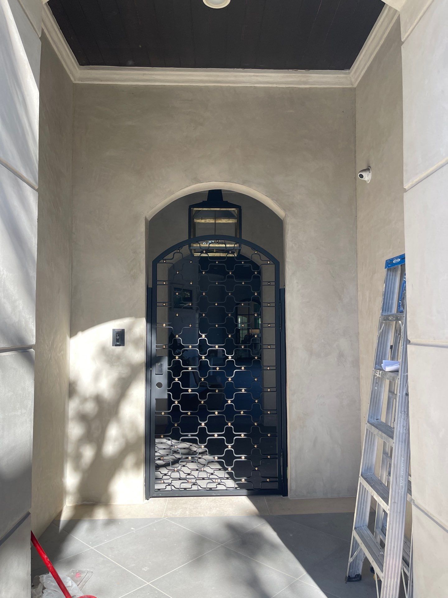 Arched Decorative Metal Security Gate Installation in Dallas by Solara Custom Living