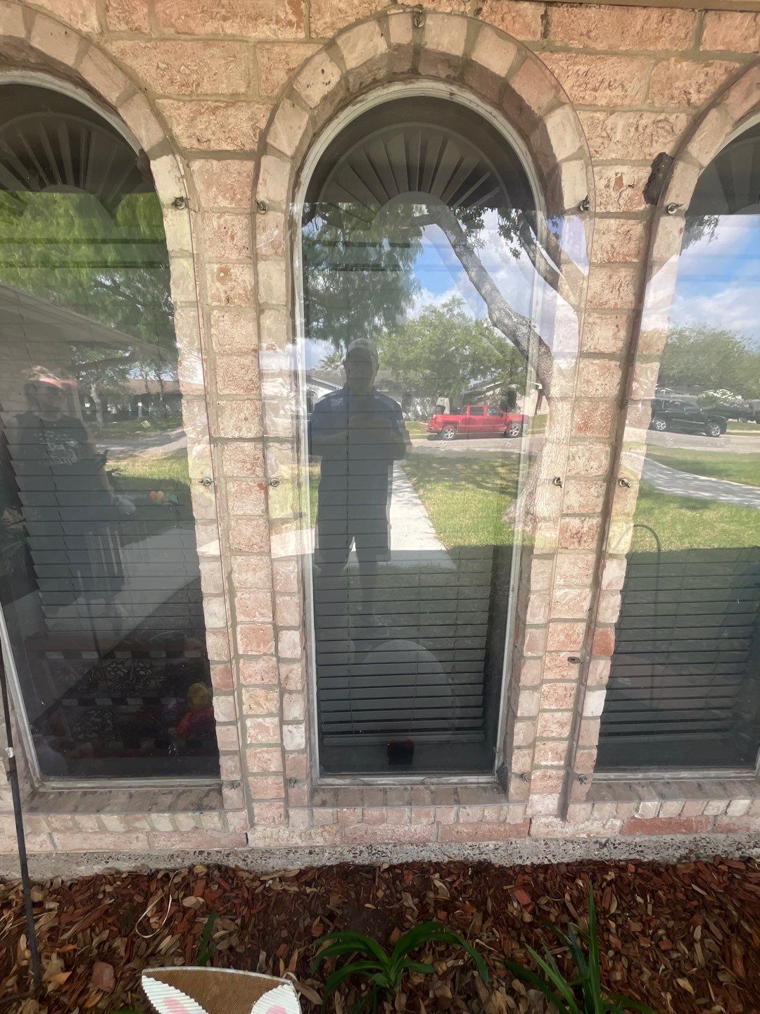 Colored Vinyl Windows to blend into brick by Bayfront Roofing and Construction