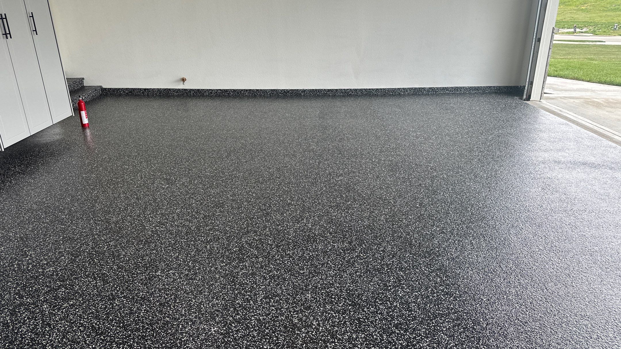 John H. received his dream garage with cabinets and a Banner Garage Floor by Banner Garage