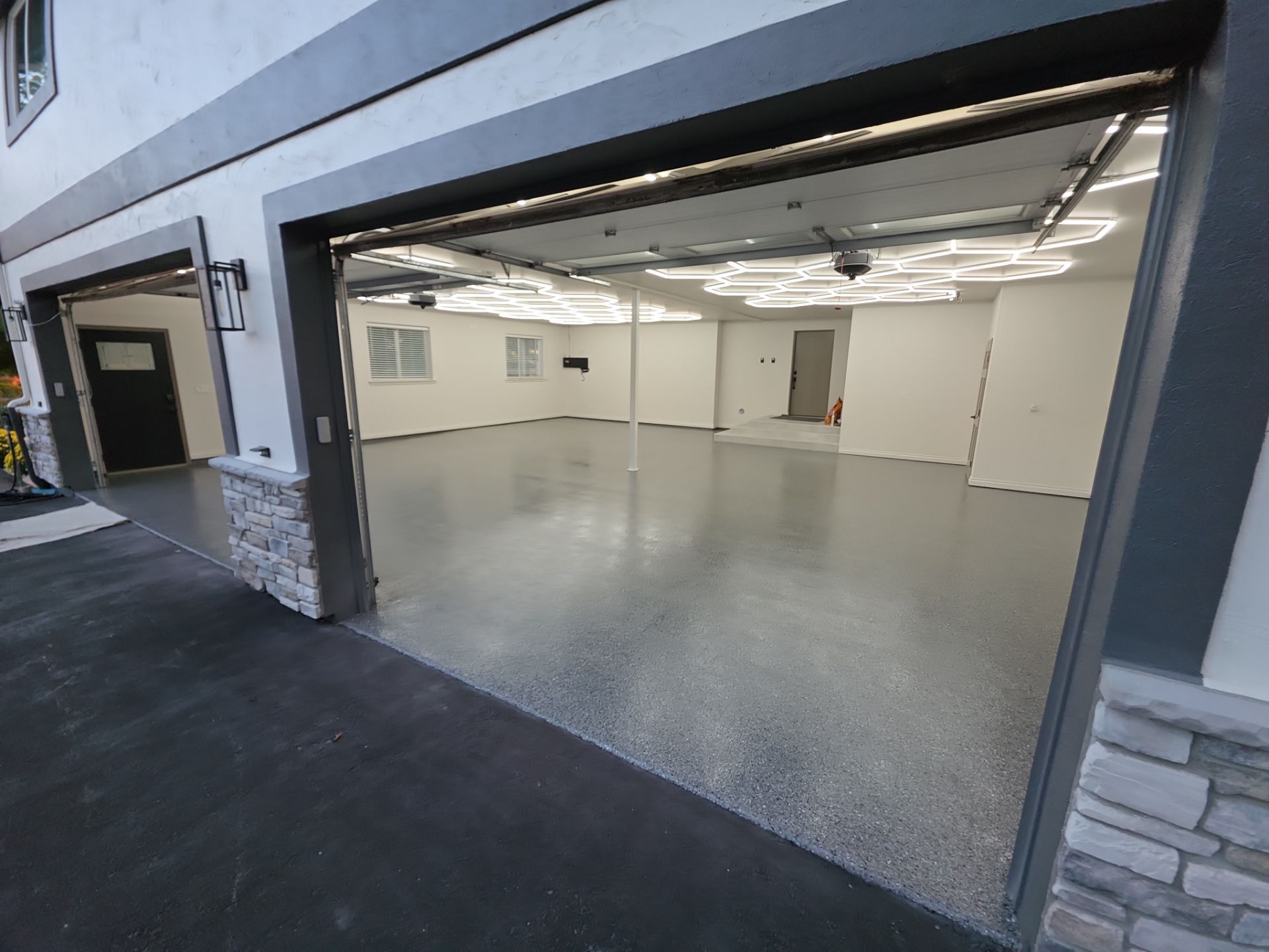 Custom Garage Transformation with Polyaspartic Coating and Hexagonal LED Lighting by Croc Coatings, LLC