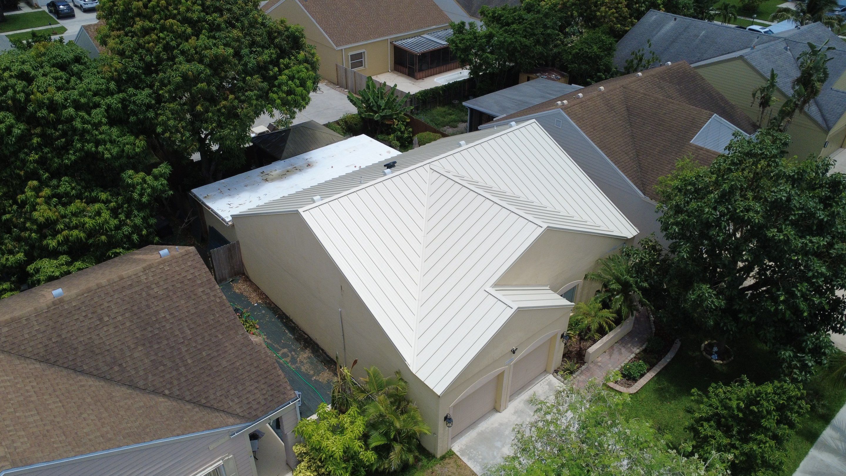Residential Roofing Installation using 1.5'' Mechanical Seam by BLUES BROTHERS ROOFING