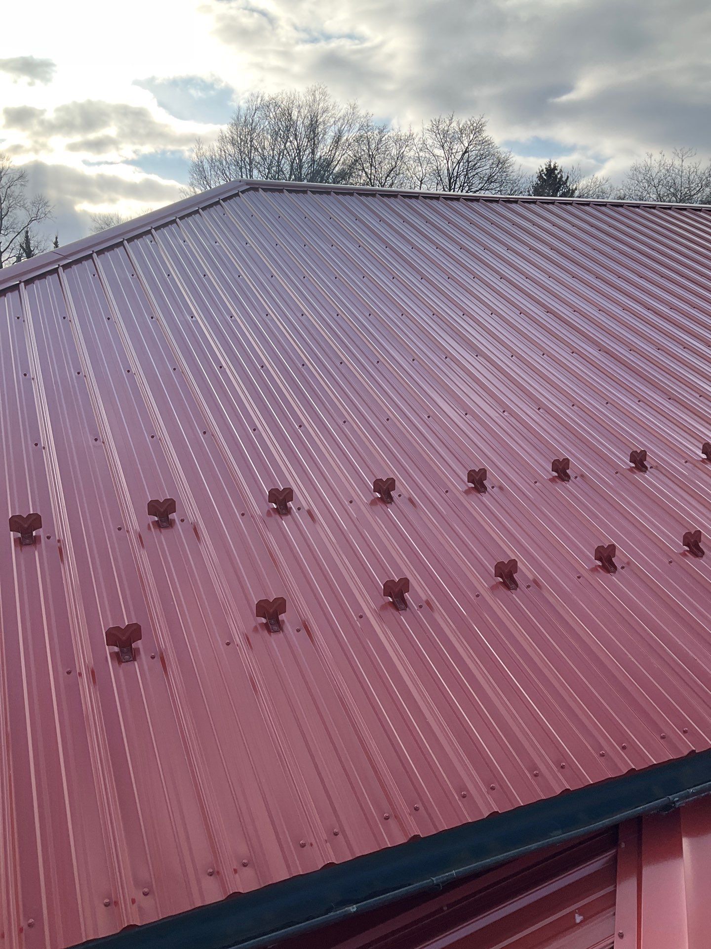 Red Metal Roofing Upgrade for Brick Home by Esh Builders