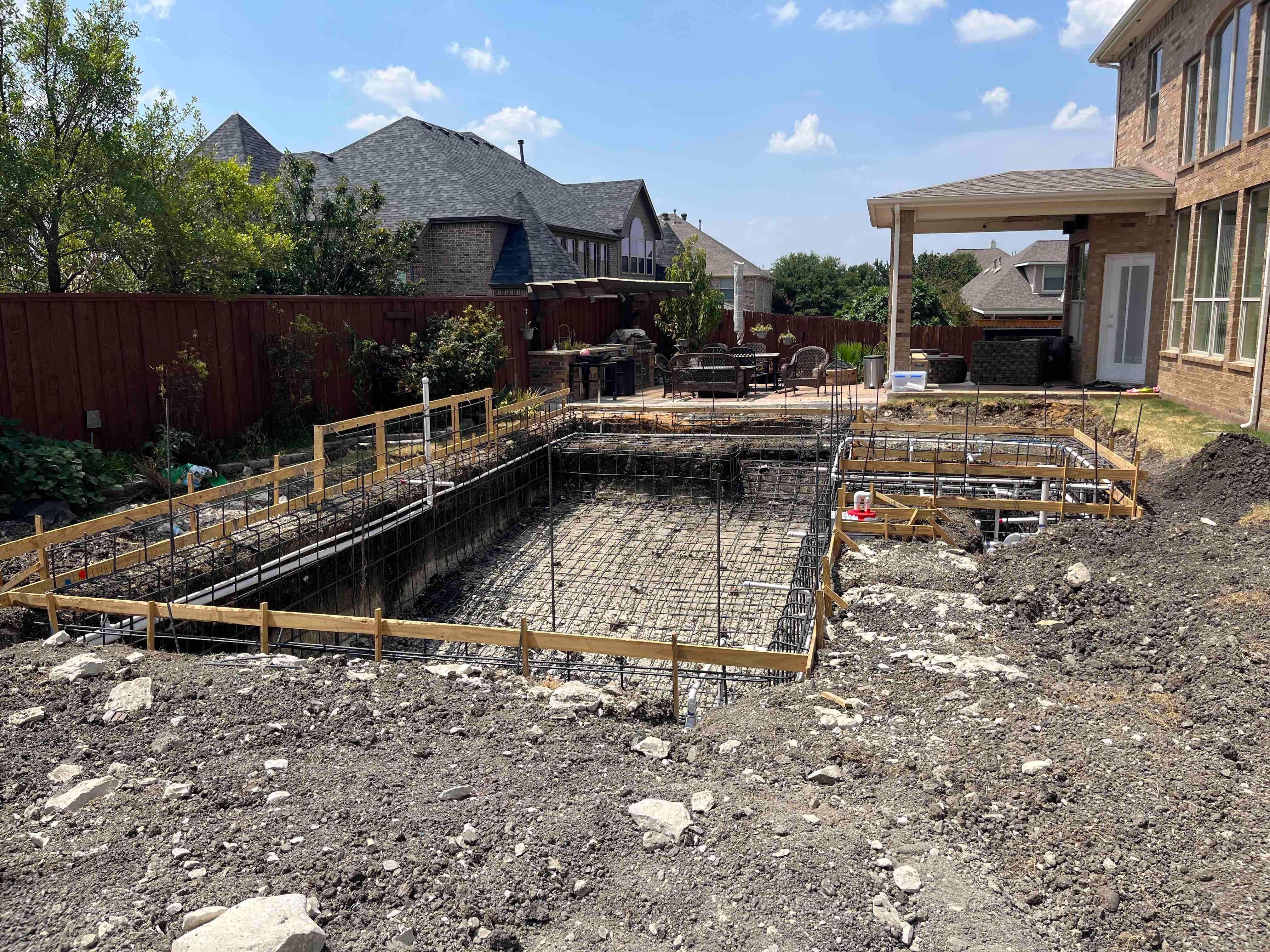 Geometric Pool with Raised Spa and Tanning Ledge by Pinnacle Pools and Spas - DFW